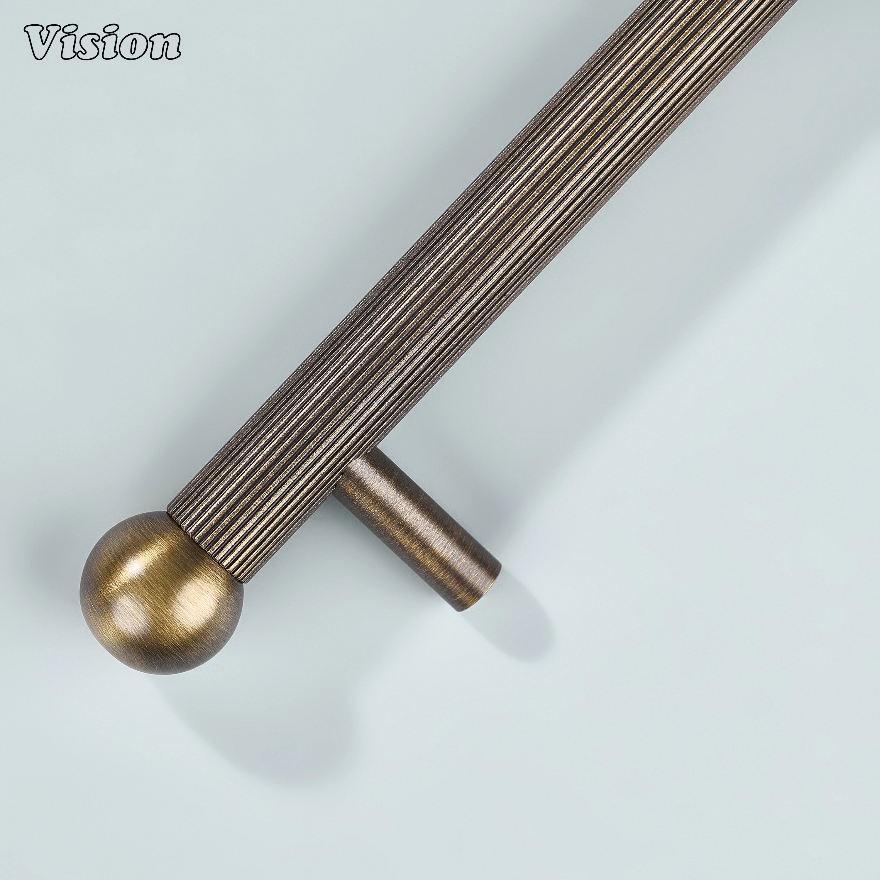 Linear knurled pull in Antique Bronze with round brass ends and cylinder legs for home furniture.