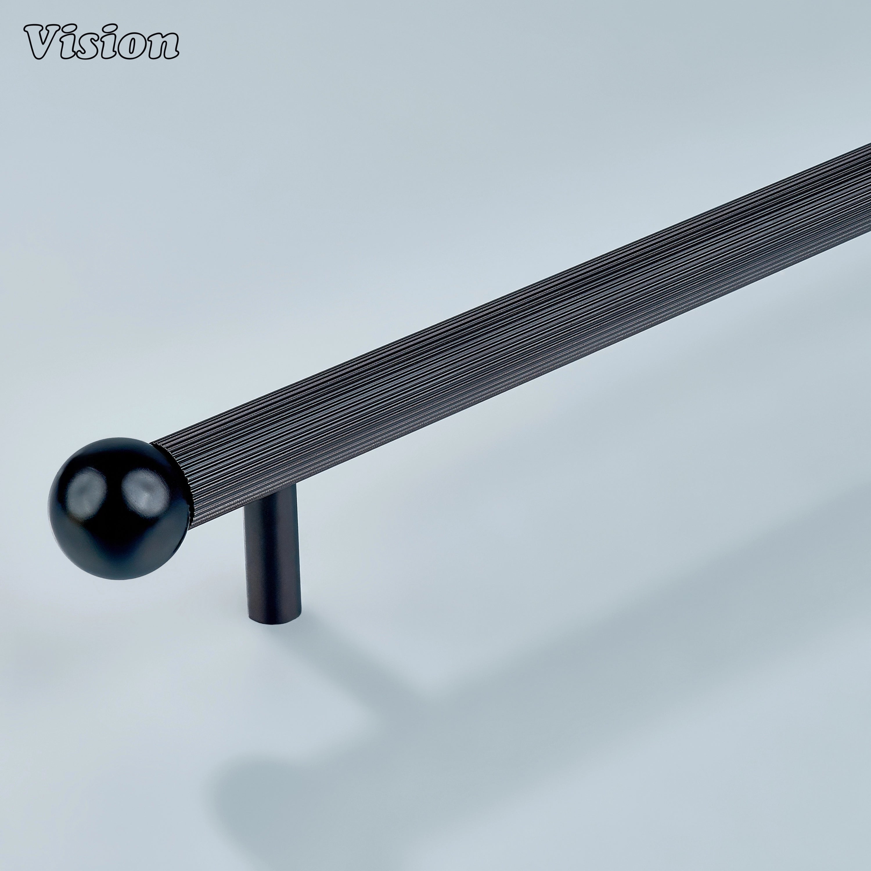 Oil Rubbed Bronze linear knurled handle with brass ball ends and cylinder legs for warm cabinetry.