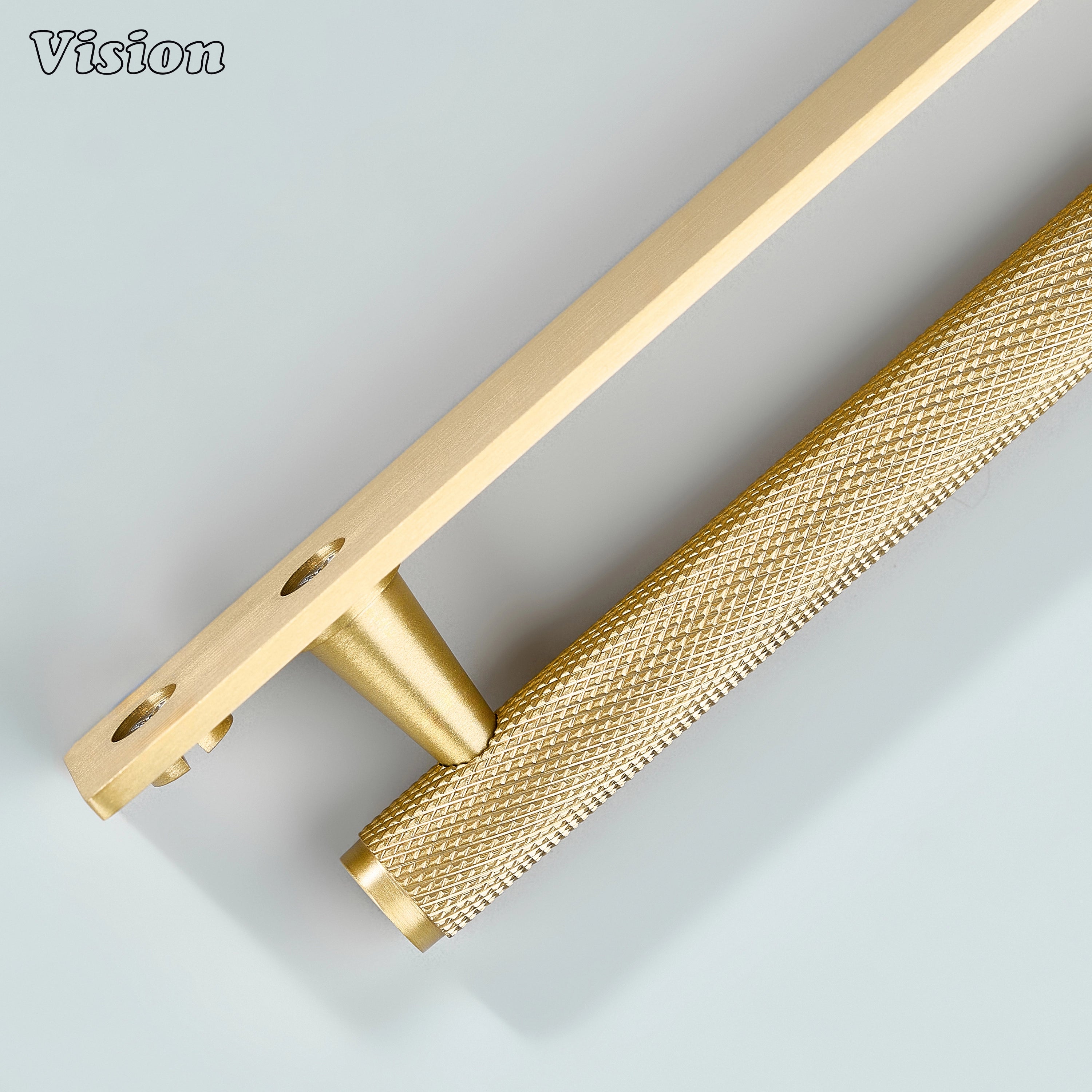 Gold knurled cabinet handle with backplate applied on wooden drawers