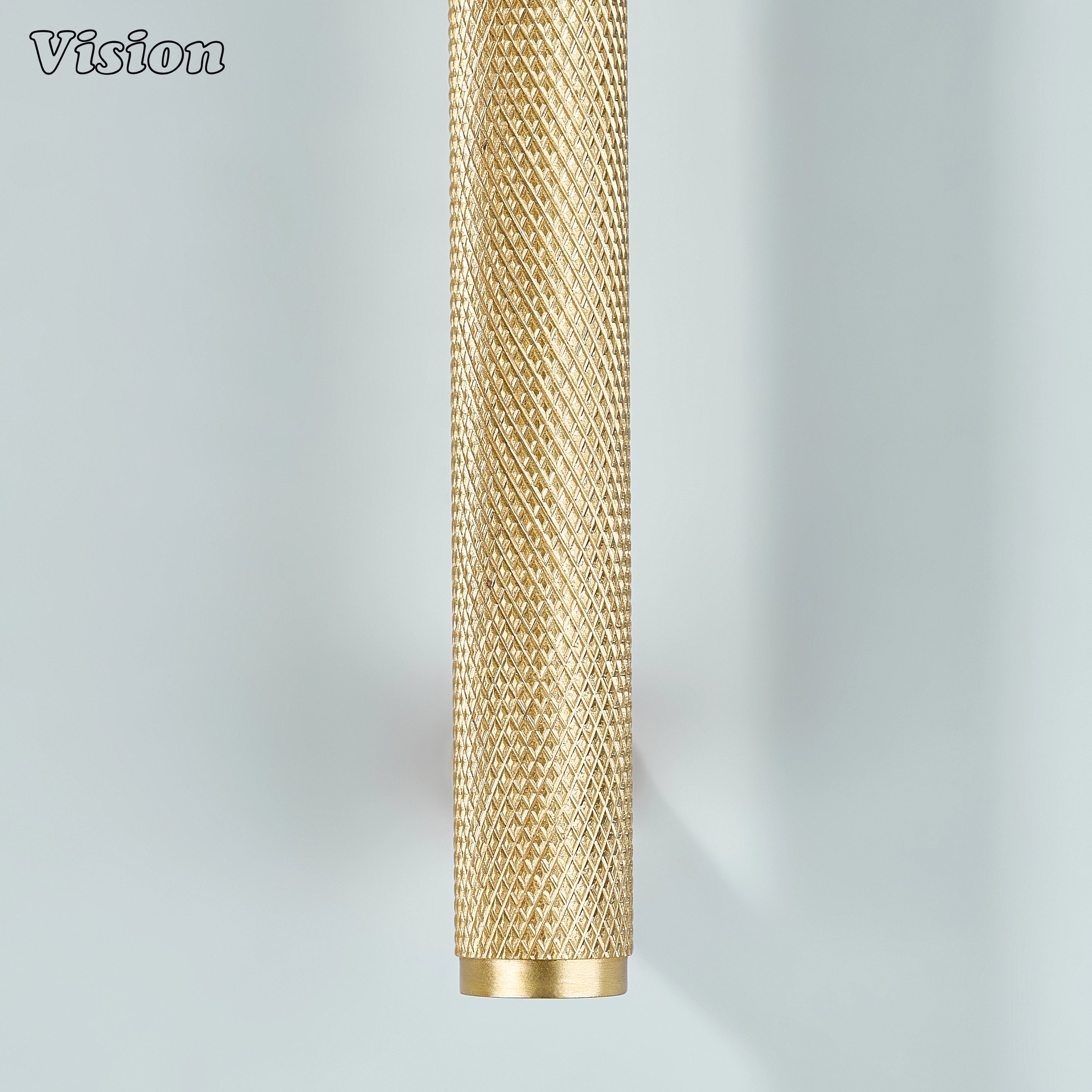 Gold textured cabinet pull installed on modular kitchen units.