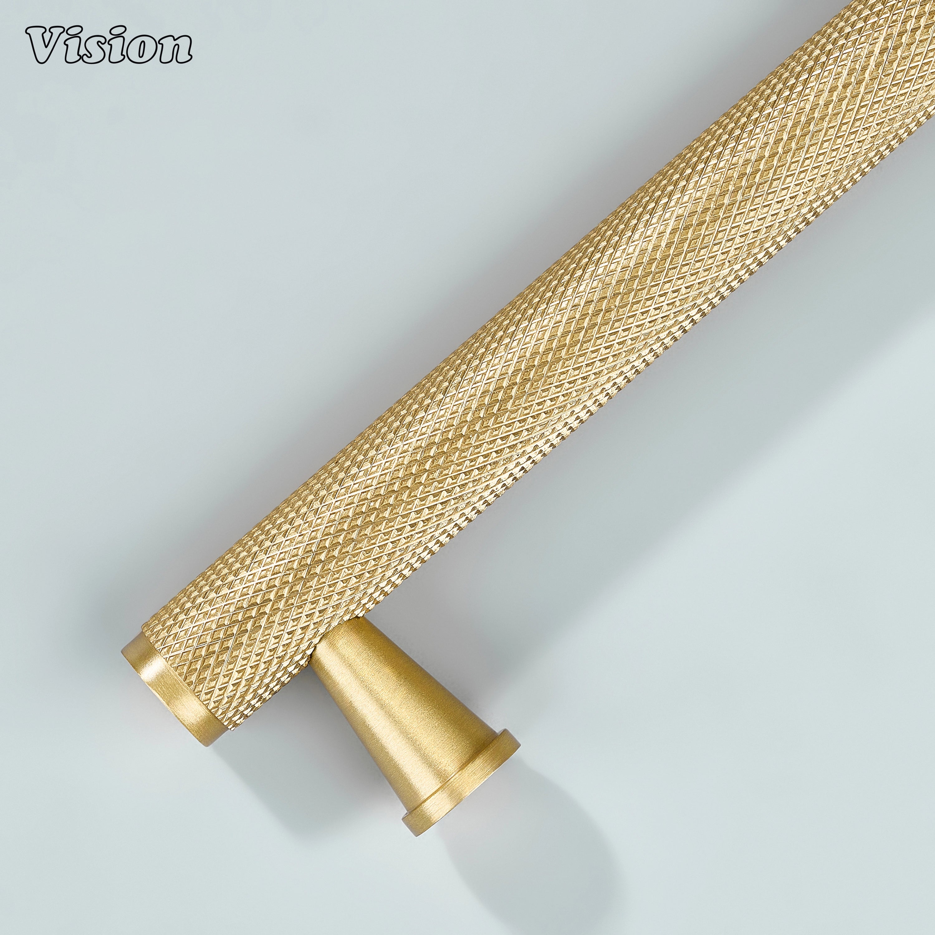 Gold knurled handle mounted on vanity cabinets.