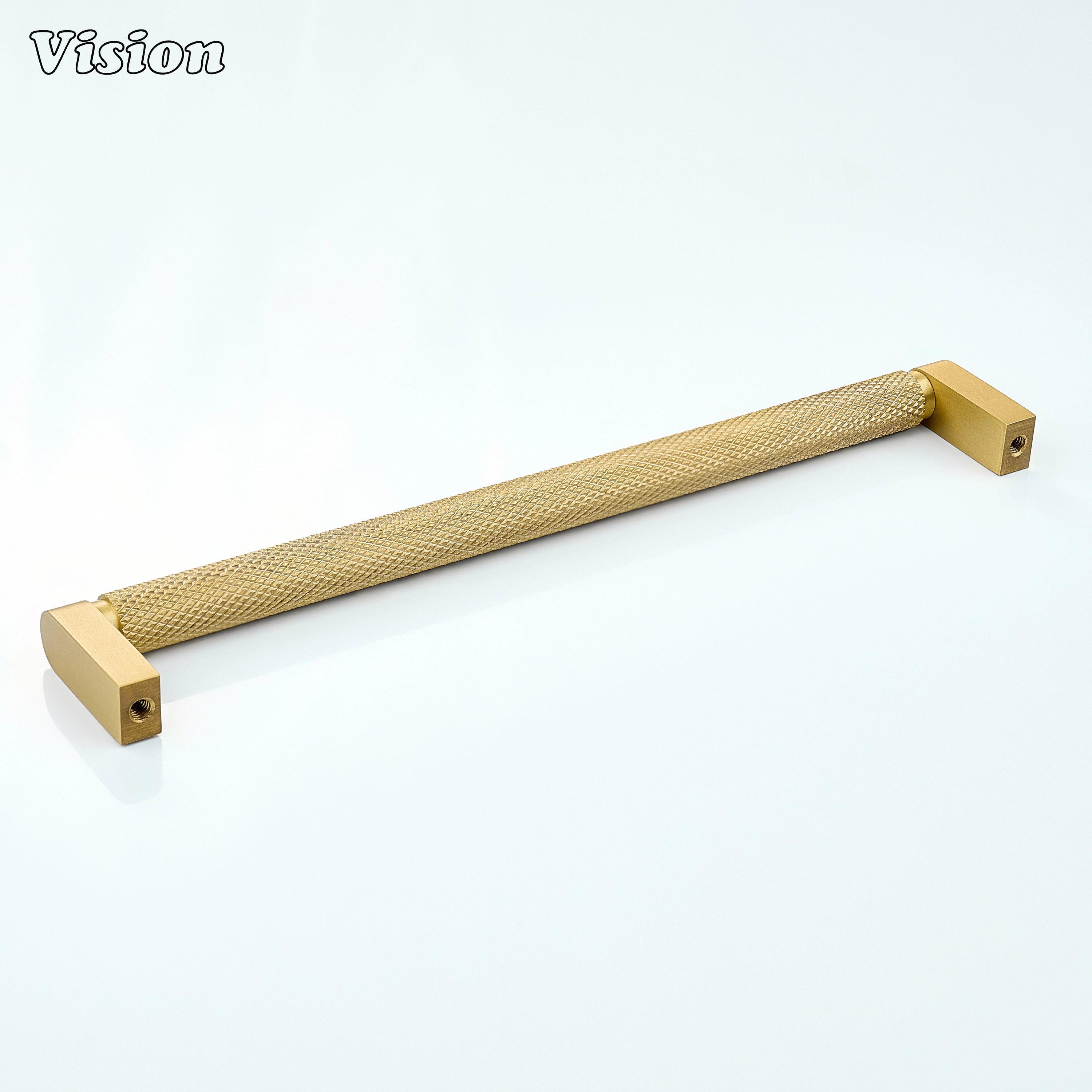 Gold ripple knurled cabinet handle used on wooden cupboards.