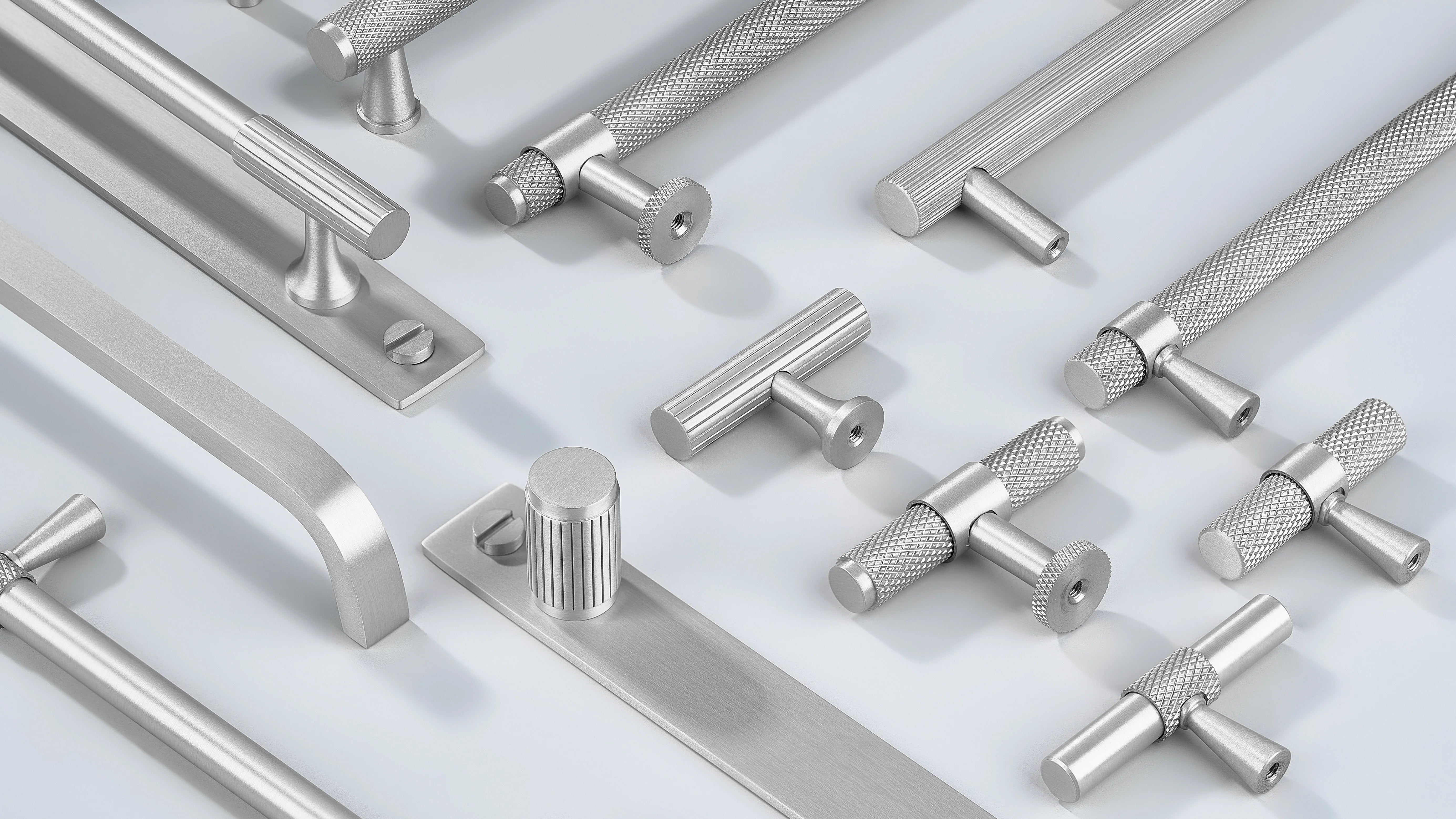 Cabinet handles in diamond knurling, linear knurling, curve shape with or without back-plate along with cabinet knobs in T shape and round shape with or without back-plate in silver finish