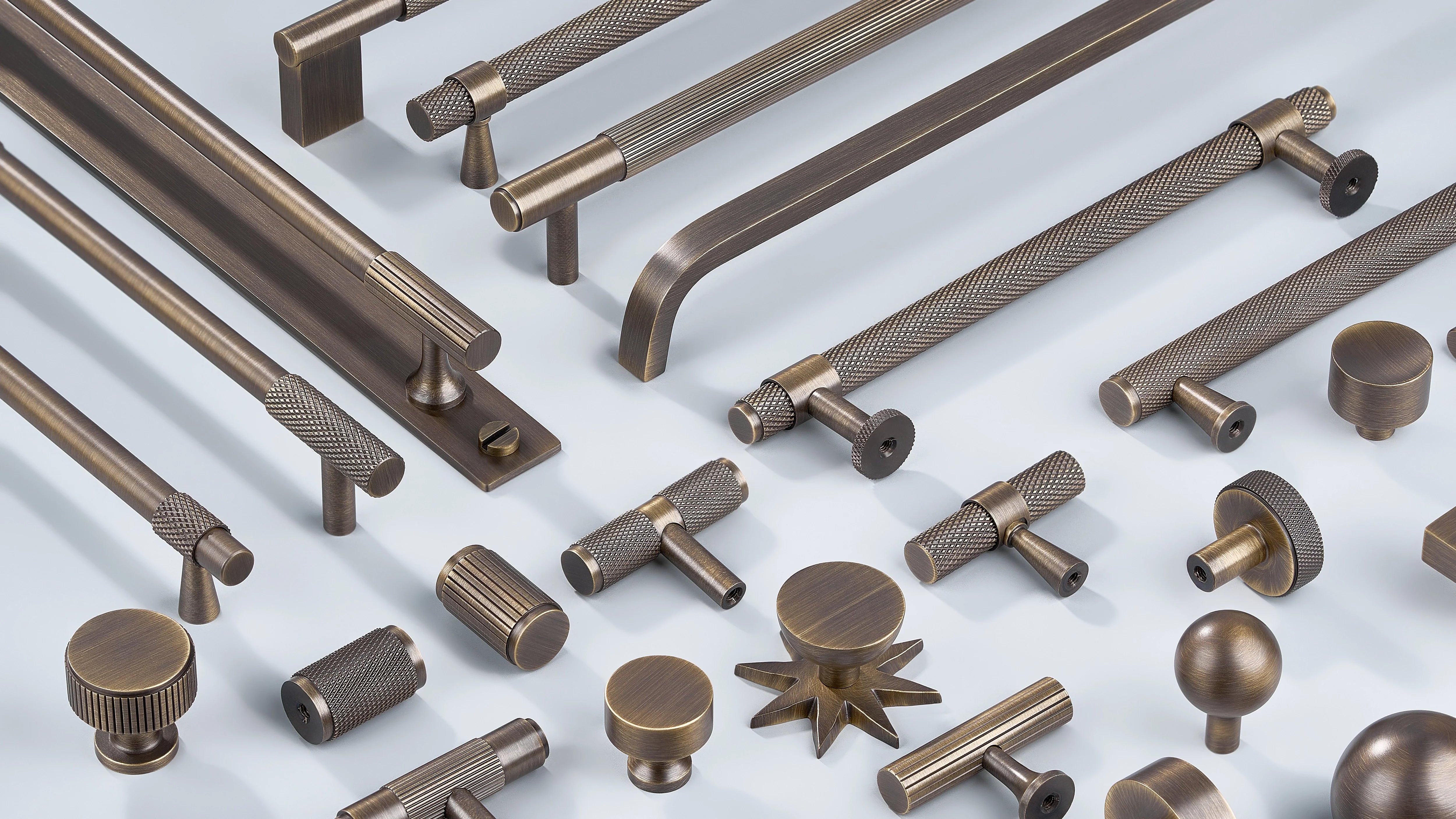 Cabinet Handle in diamond knurling, linear knurling and curve design along with cabinet knobs in round shape, T shape sphere shape in antique bronze