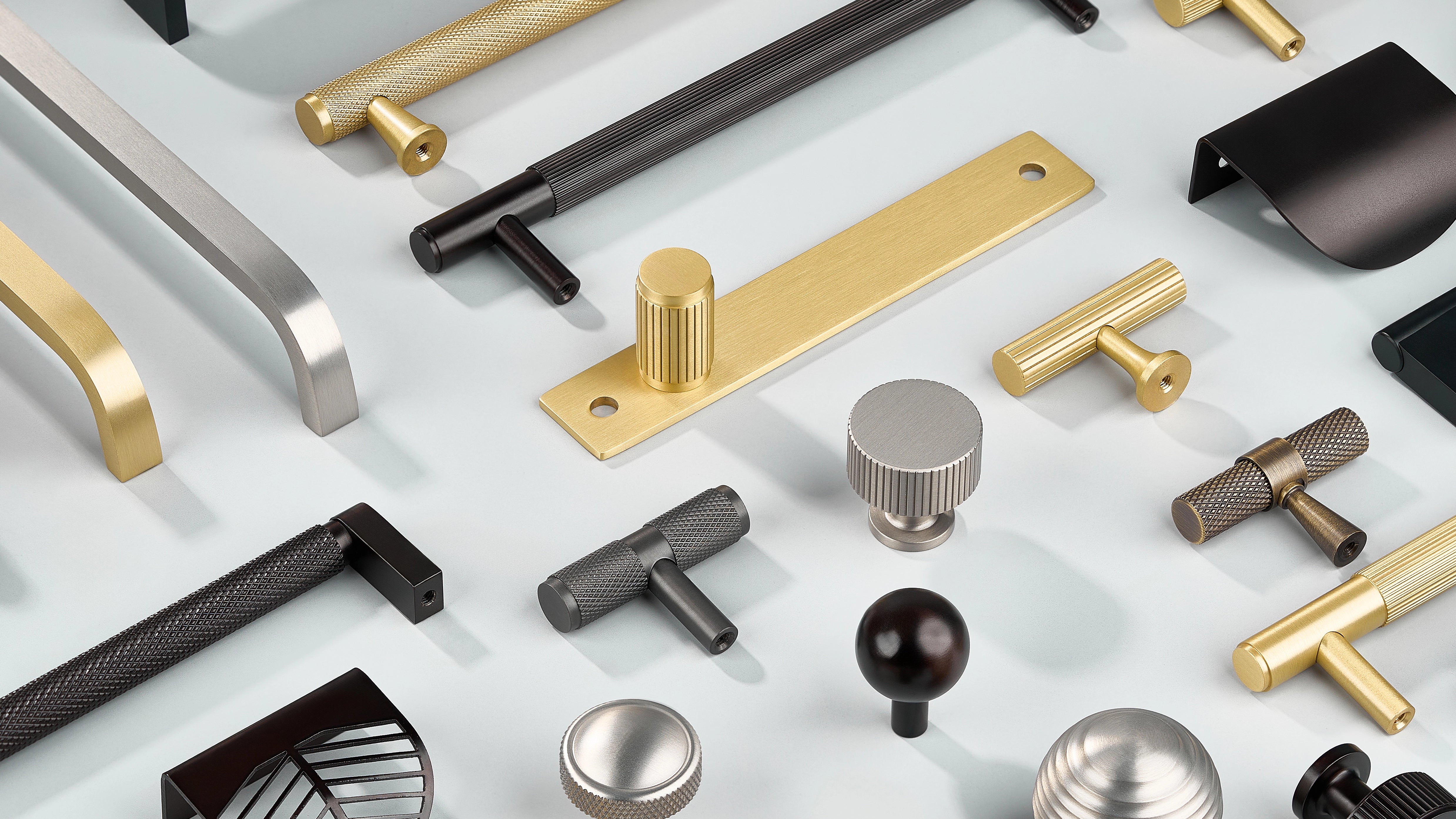 Cabinet Handles in diamond knurling, linear knurling and curve without knurling in oil rubbed bronze, antique bronze, gold, silver and black finishes. Cabinet knobs in diamond knurling, linear knurling with/without back-plate in oil rubbed bronze, antique bronze, gold, silver and black finishes. Cabinet Curved Profile Handles in oil rubbed bronze, antique bronze, gold, silver and black finishes. Wall Hook in Silver finish