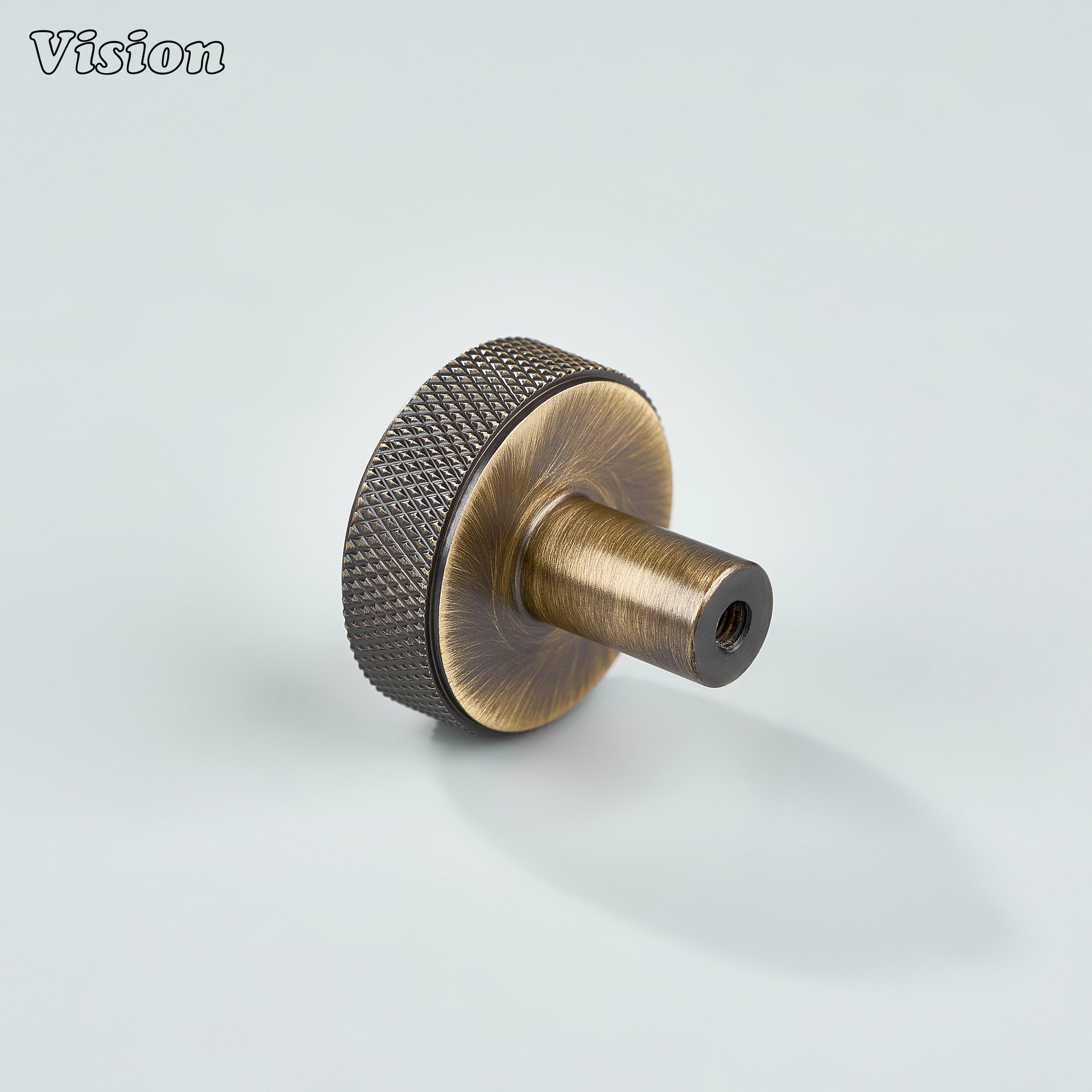 Antique Bronze cabinet knob featuring textured knurled sides and round top for wardrobes