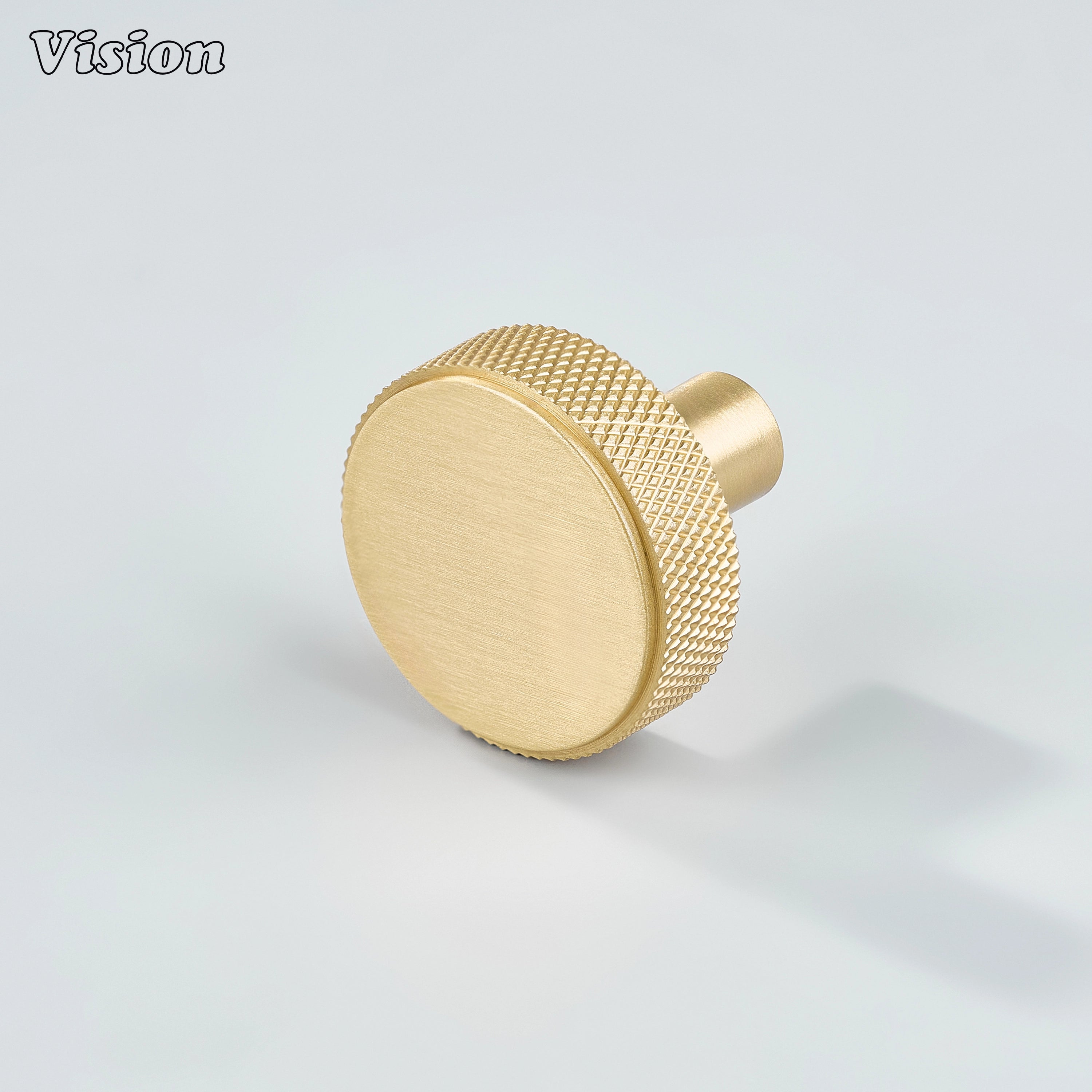 Gold cabinet knob with round knurled profile and cylindrical leg for kitchen cabinets