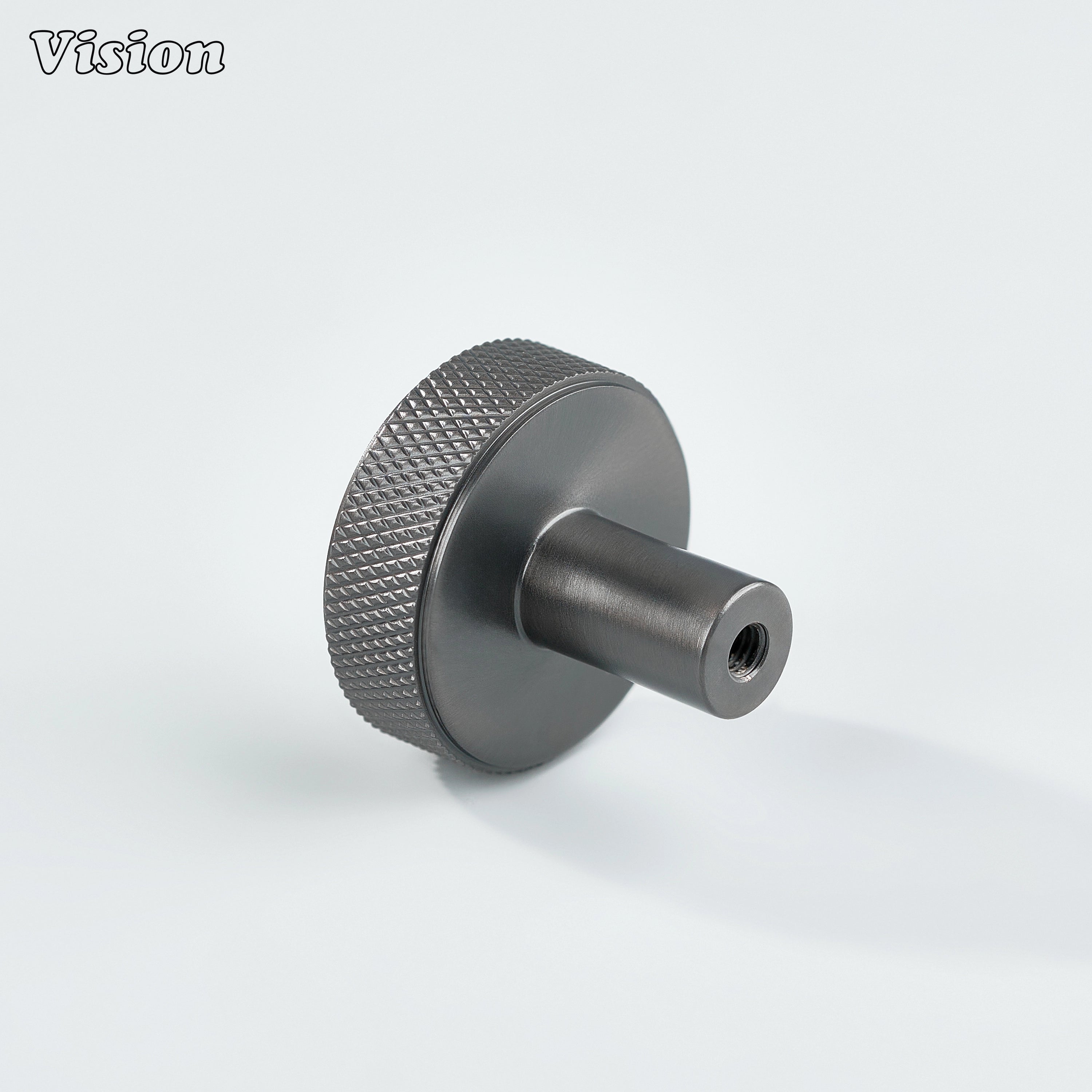 Gunmetal cabinet knob with textured knurled sides and flat round top