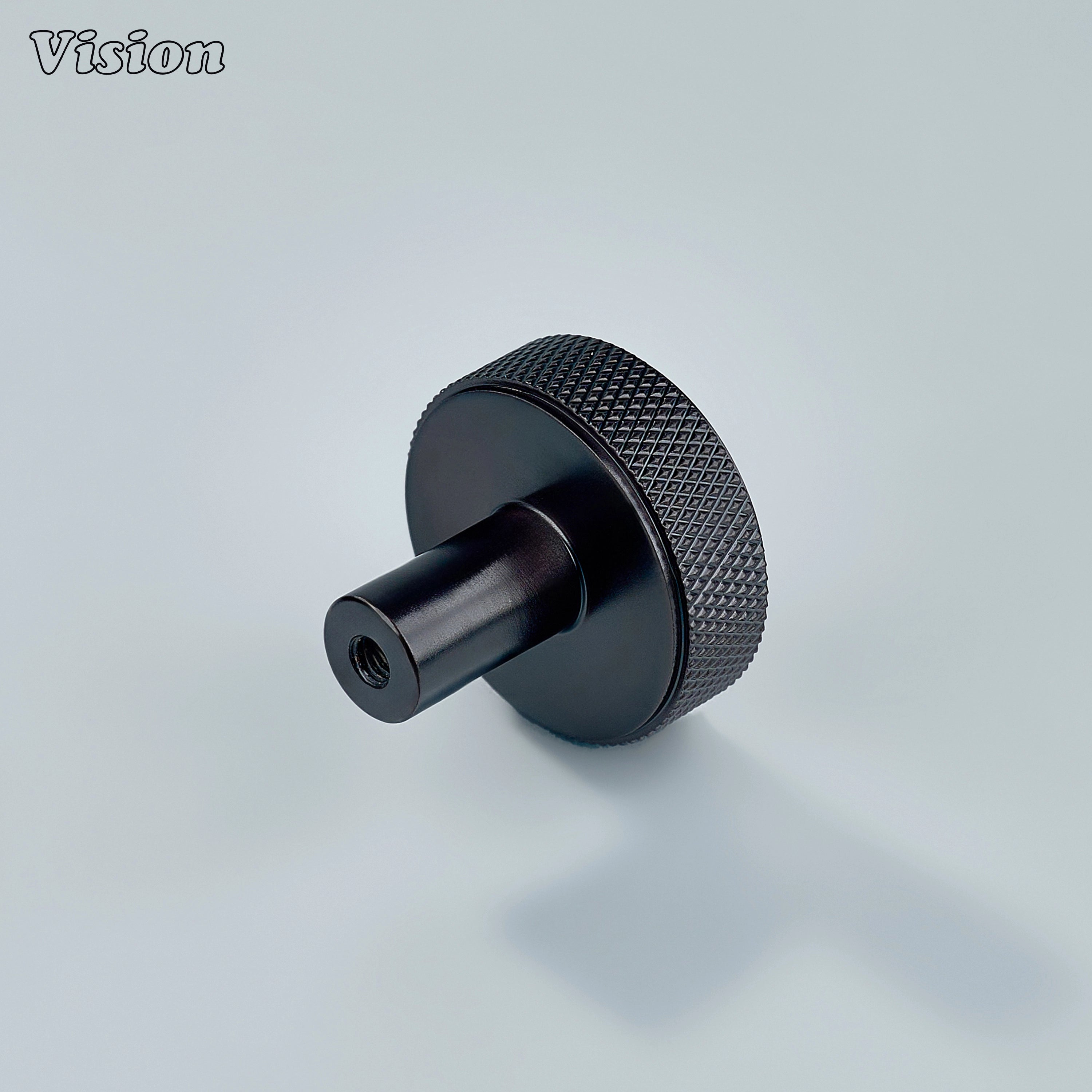 Round textured knob in oil rubbed bronze crafted for elegant cabinet hardware upgrades.
