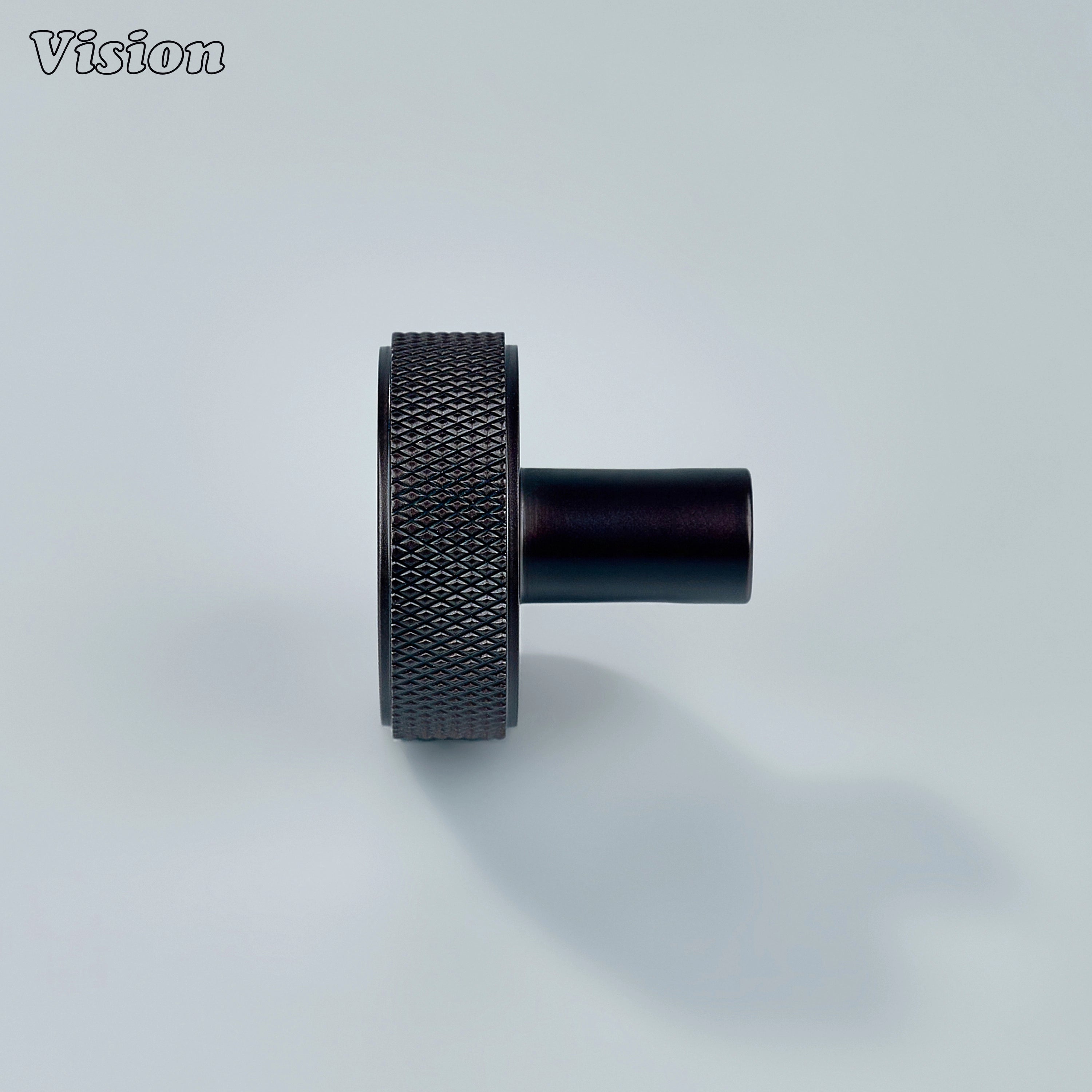 Oil rubbed bronze round cabinet knob with textured face for premium furniture fittings.