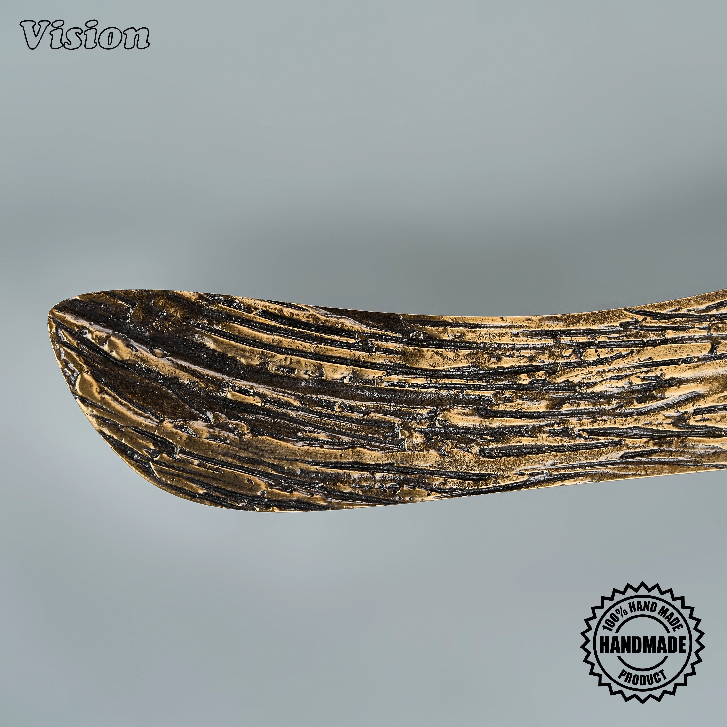 Antique bronze artisanal appliance handle with tactile carved surface and solid posts for doors