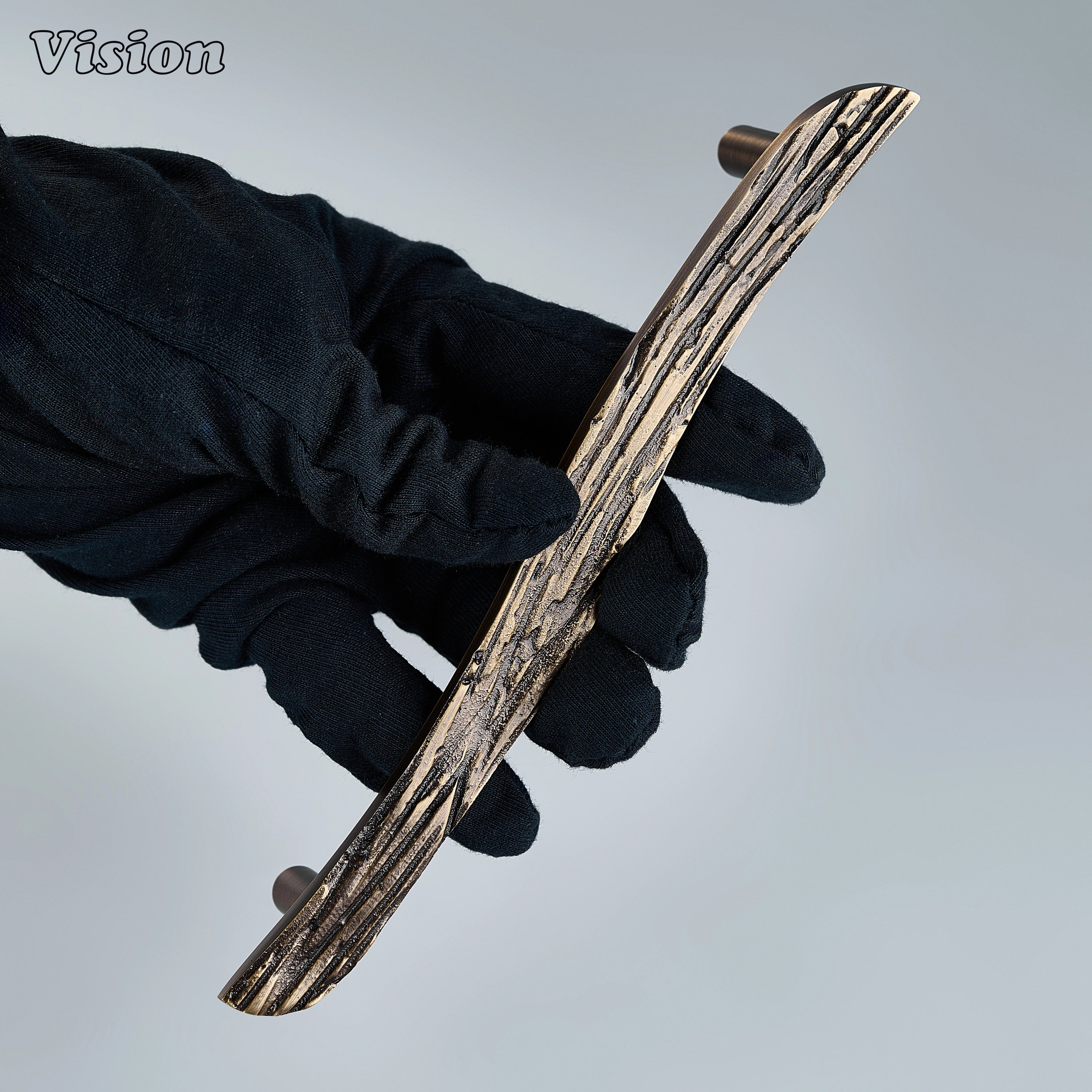 Heavy-duty antique bronze cabinet hardware with sculpted brass carved bar for tall cupboards