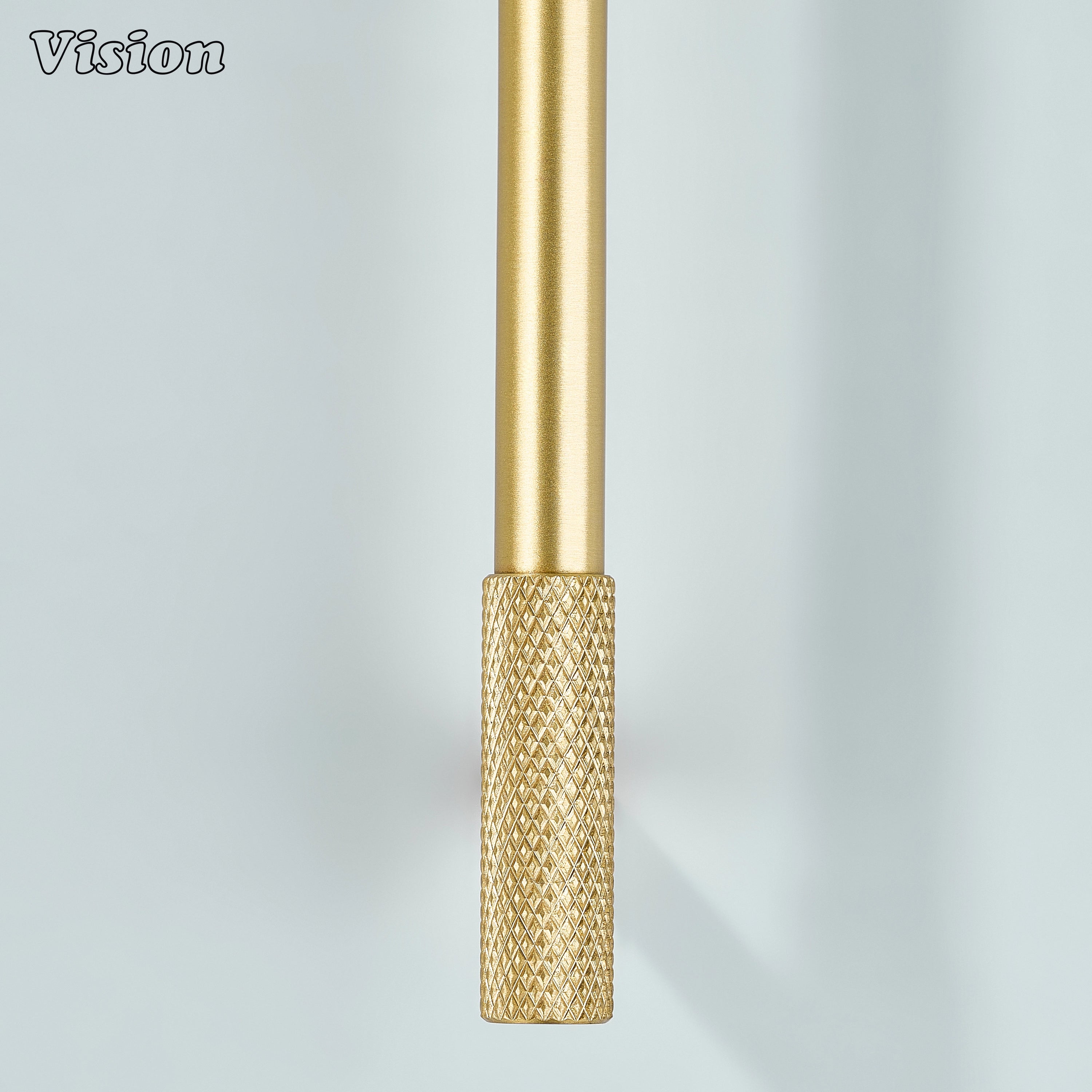 Gold knurled cabinet pull with cylindrical design