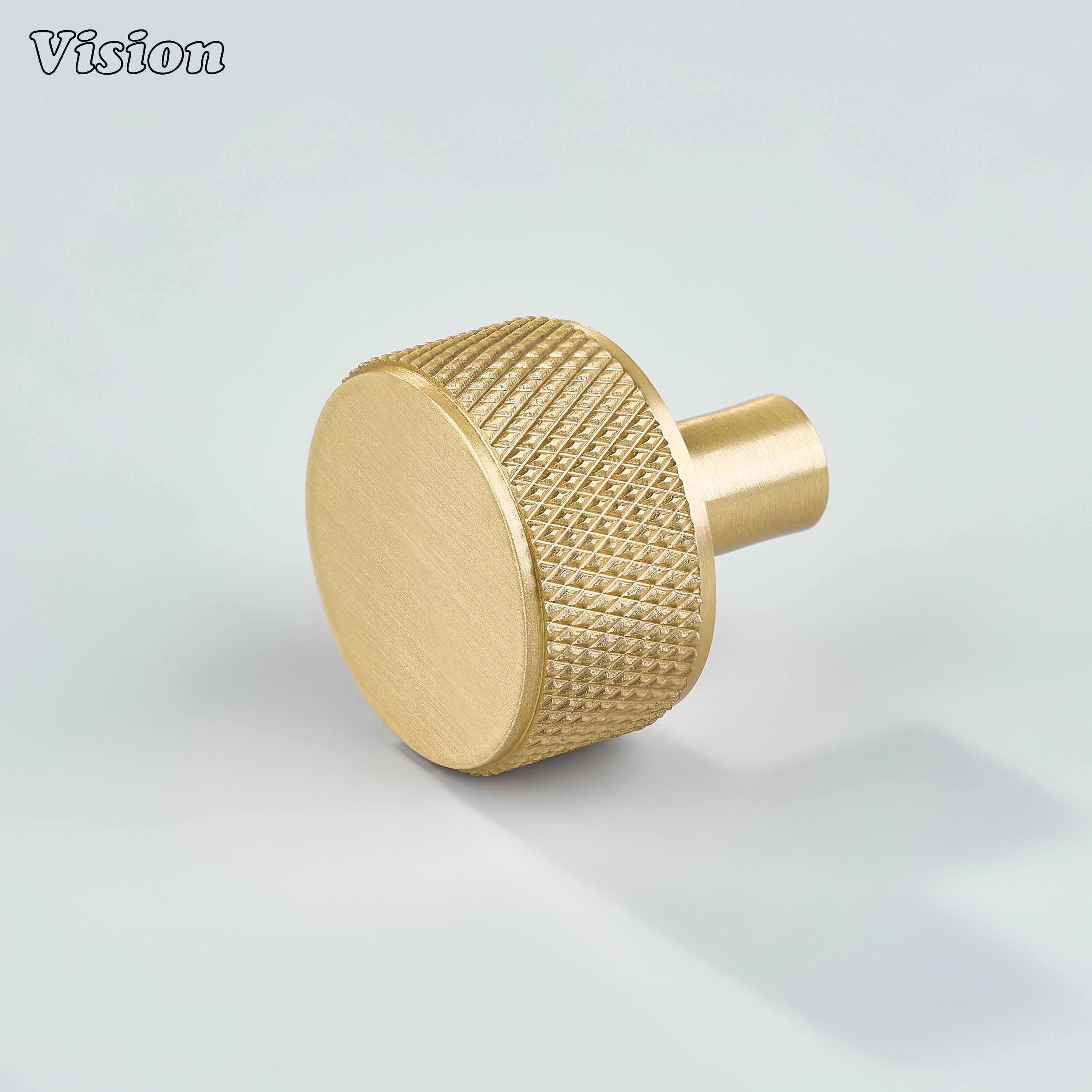 Gold cabinet knob with round knurled grip and cylinder leg for modern kitchen cabinets