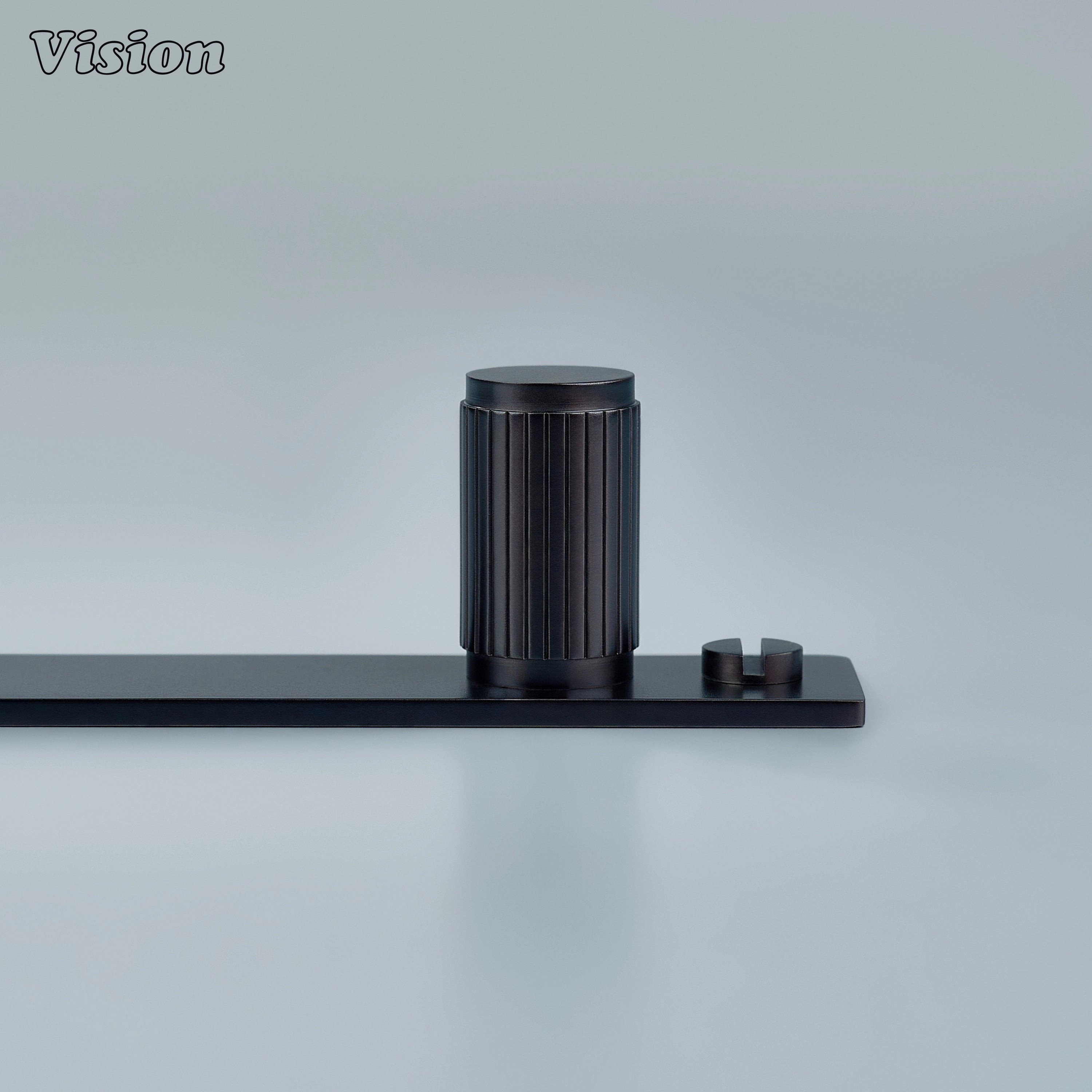 Linear knurled Oil Rubbed Bronze cabinet knob with cylindrical brass form on backplate