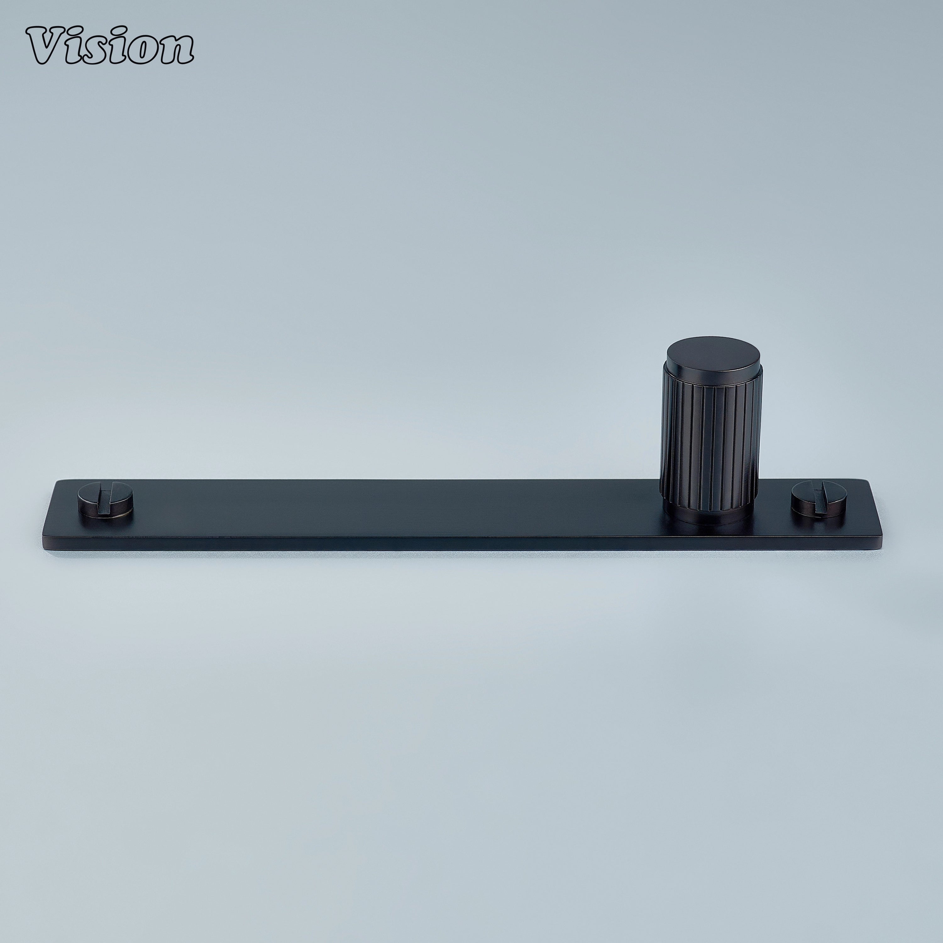 Cylindrical Oil Rubbed Bronze cabinet knob mounted on brass backplate for wardrobes