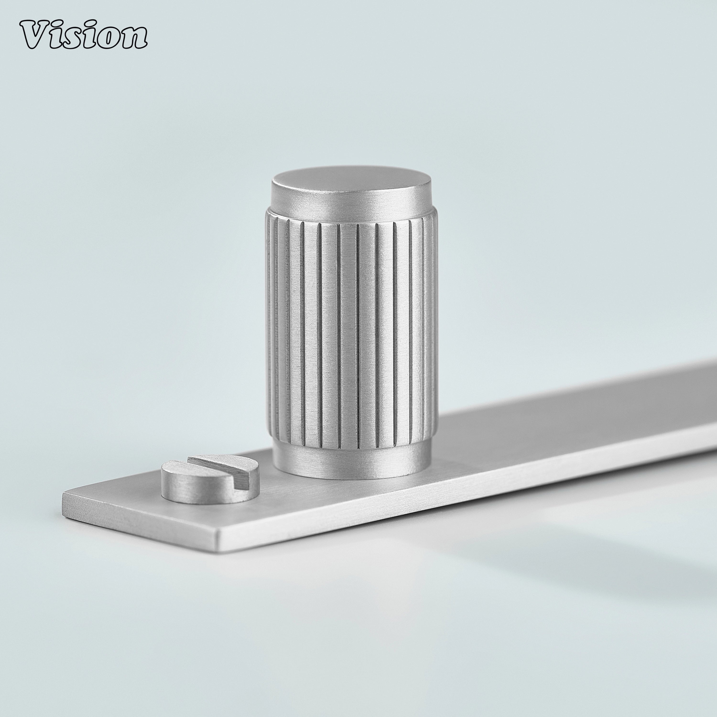 Linear knurled Silver cabinet knob with cylindrical brass form on backplate for wardrobes