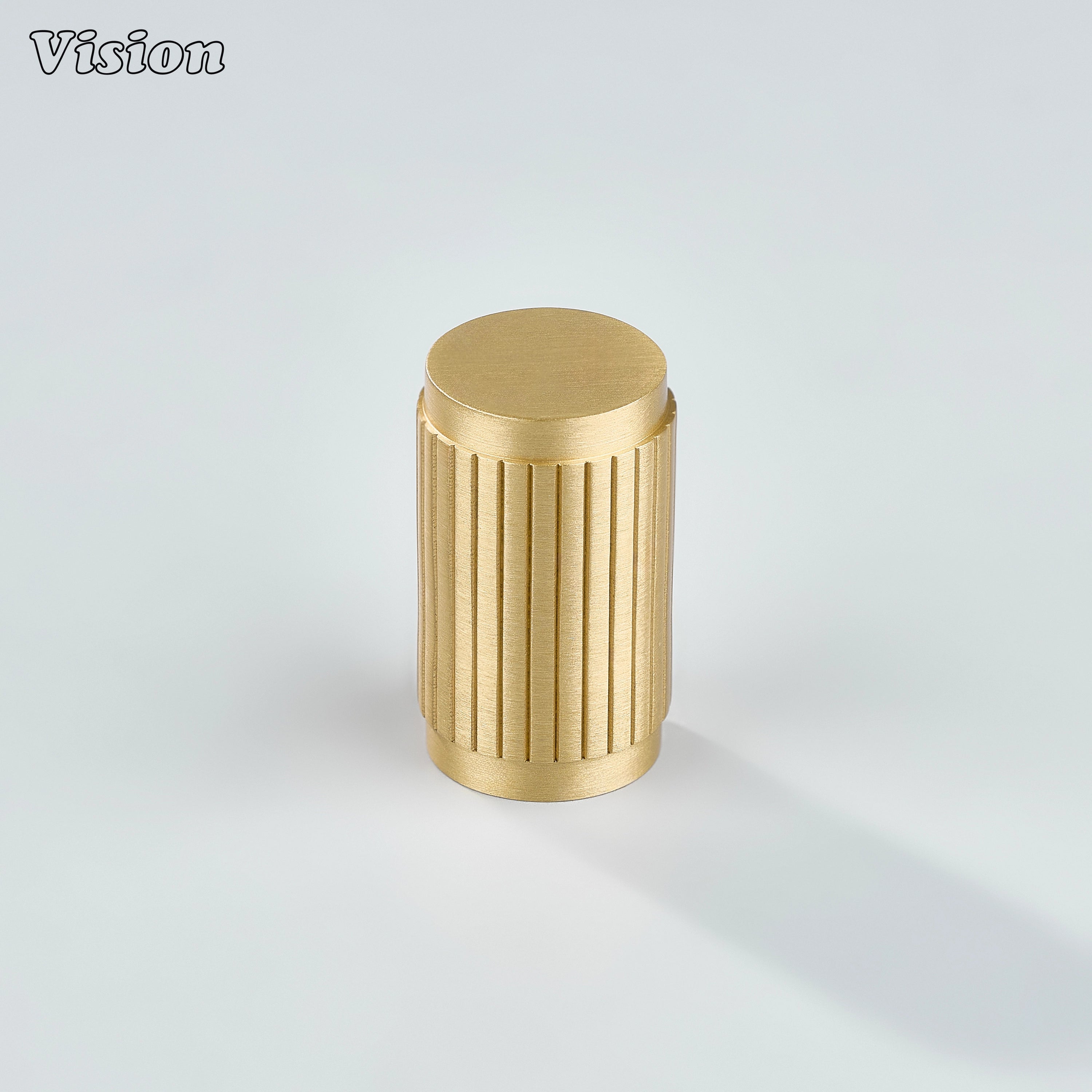 Linear knurled gold cabinet knob featuring cylindrical brass form for wardrobe doors