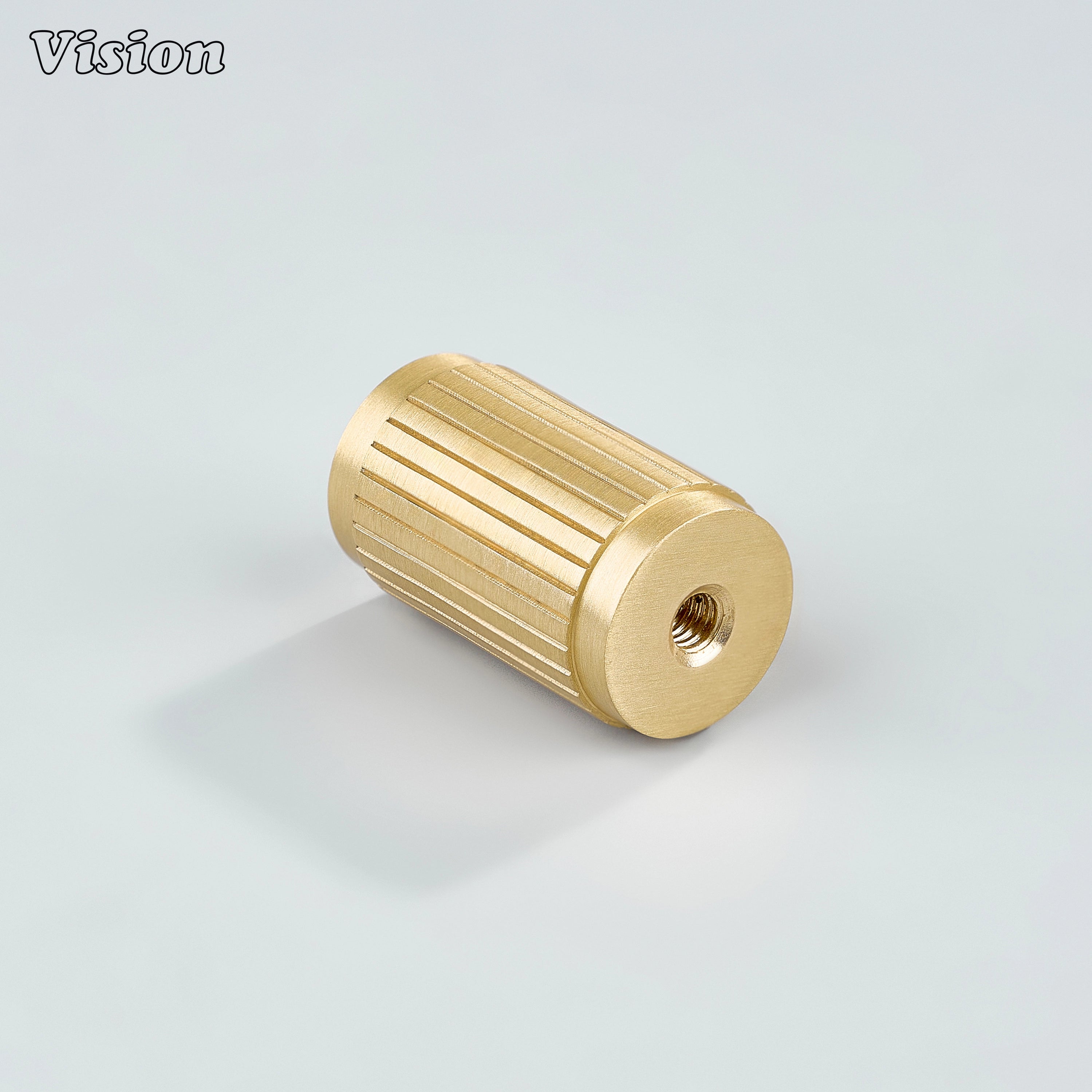 Gold brass cylinder cabinet knob with linear profile for contemporary drawers
