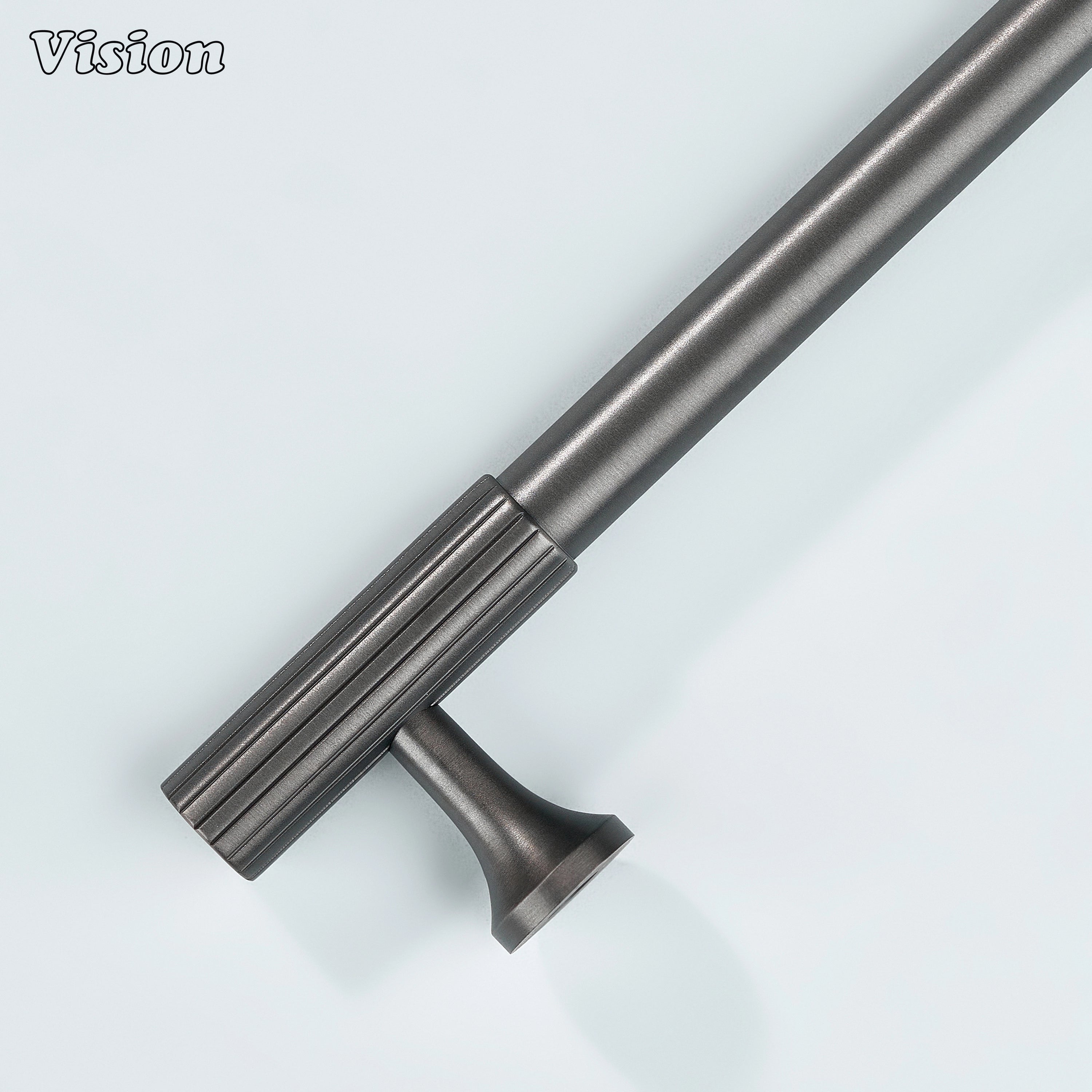 Gunmetal cabinet pull with architectural profile and knurled detailing.