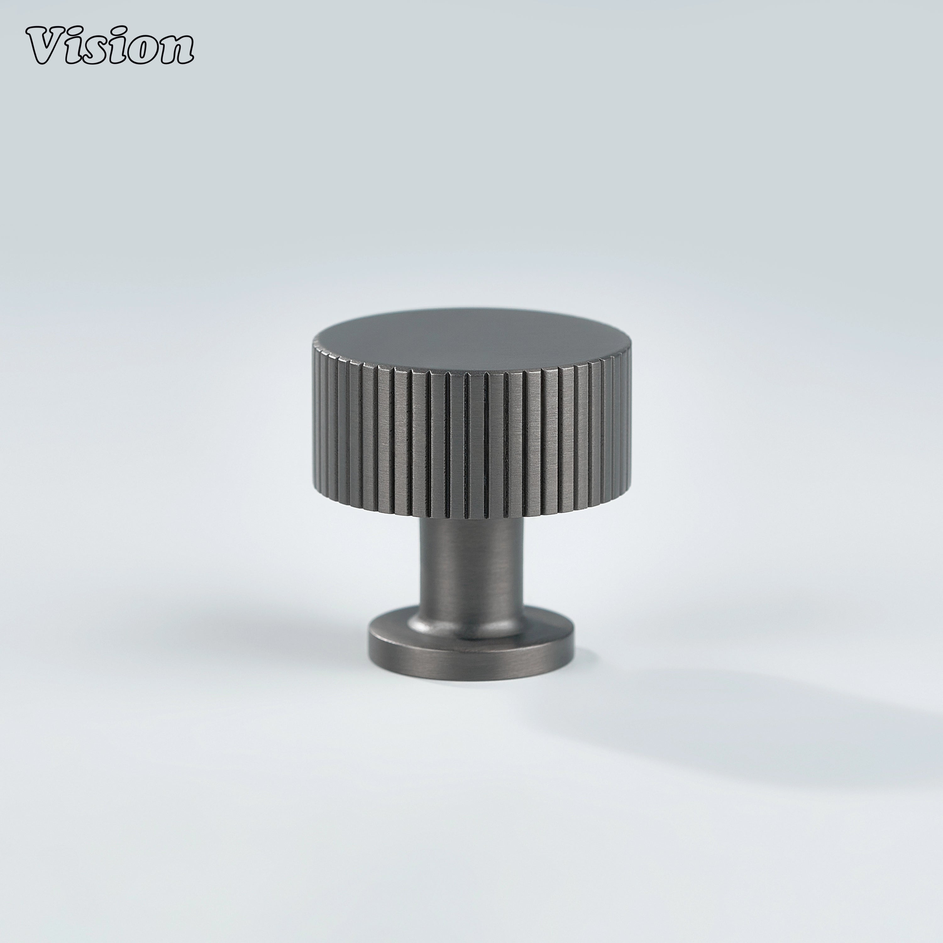 Gunmetal round cabinet knob featuring knurled brass detailing for wardrobes and furniture