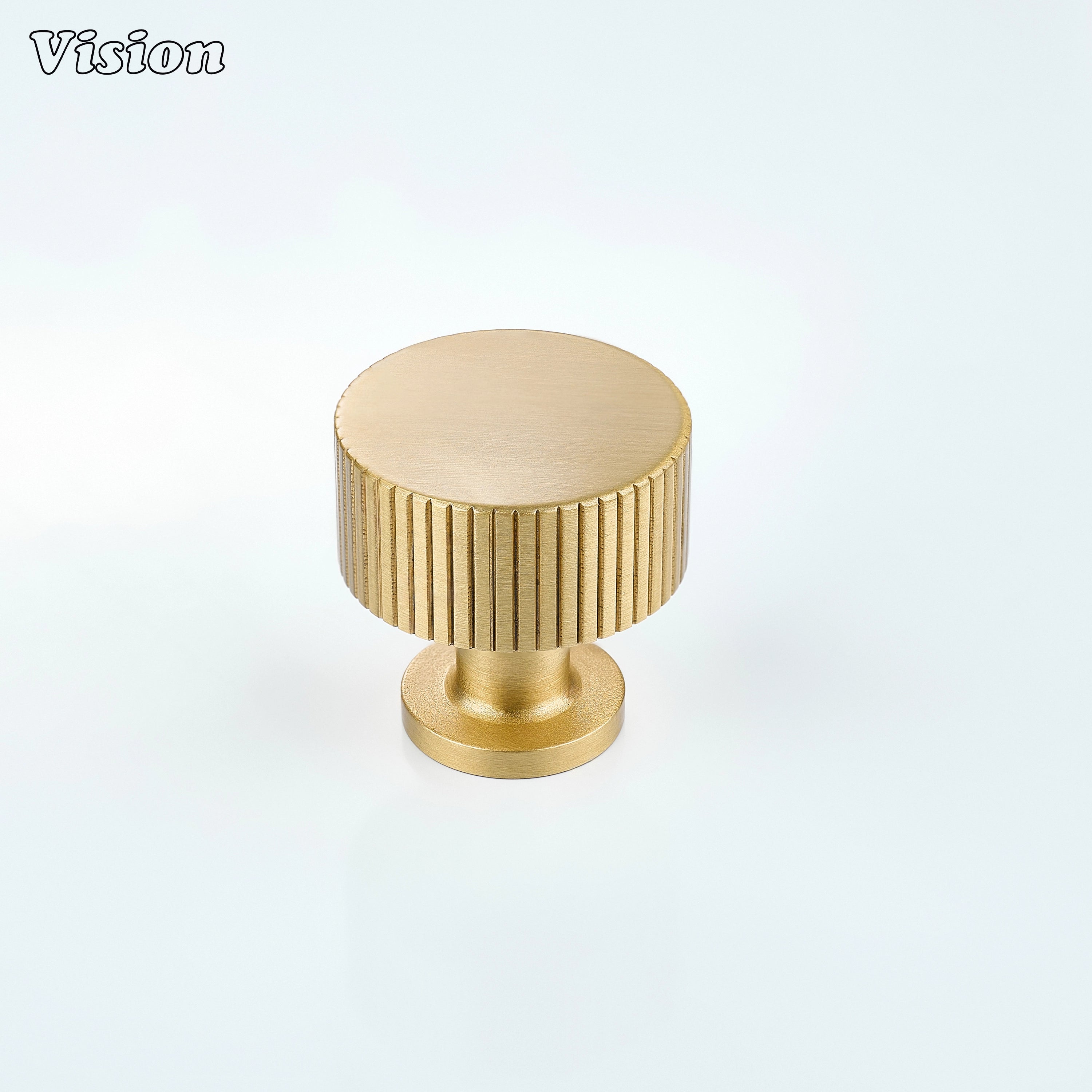 Gold brass cabinet knob with round shape and linear knurled texture for modern furniture interiors