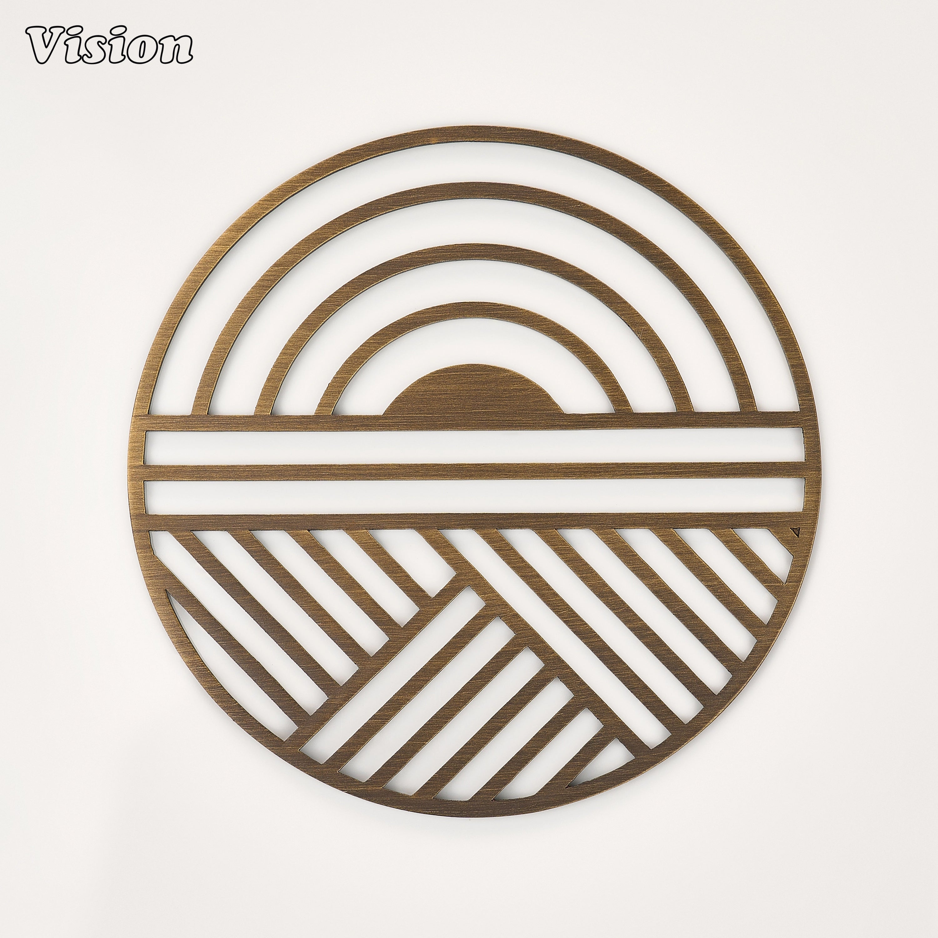 Antique Bronze solid brass round coaster featuring a precision-cut geometric sunrise motif on a dining table