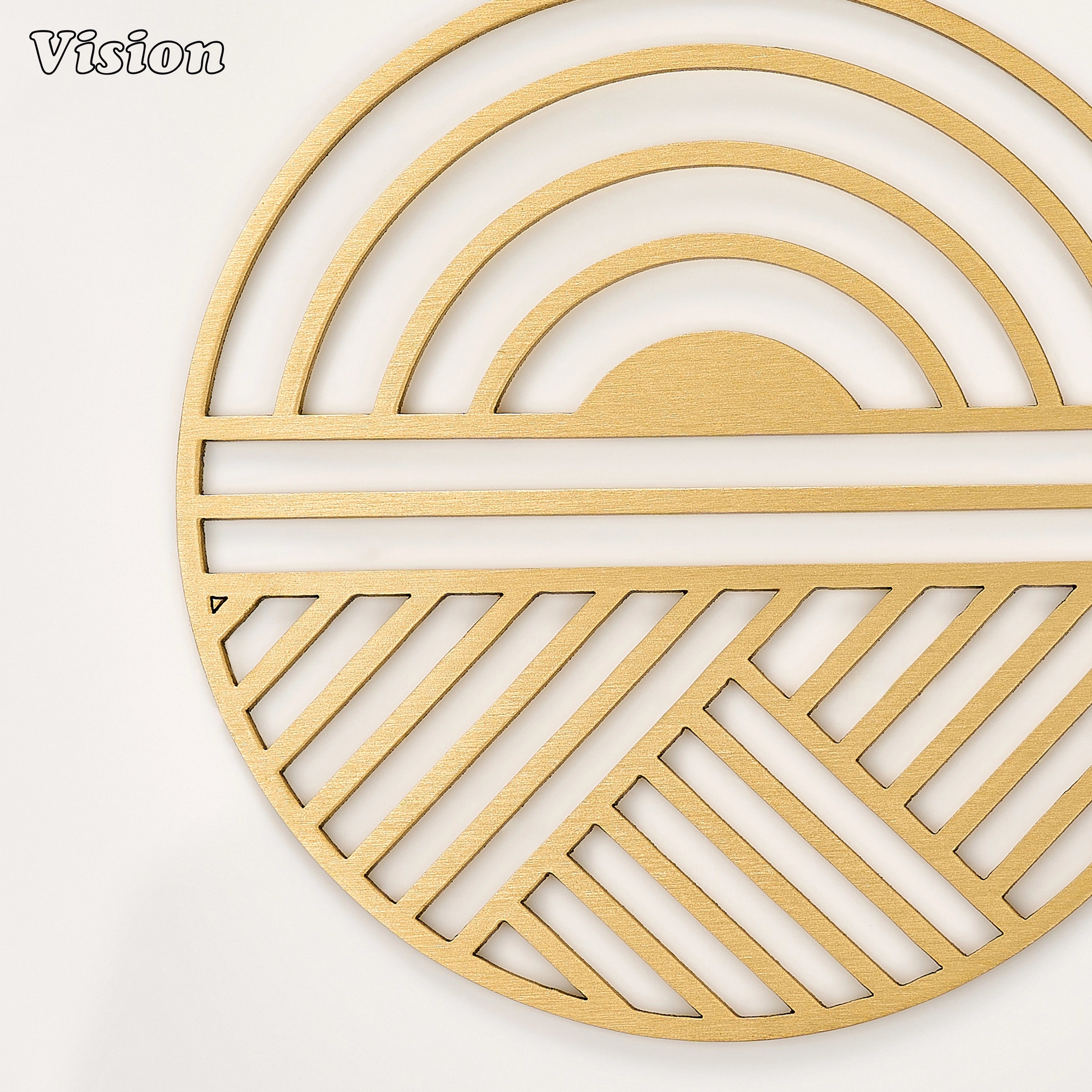 Sleek gold solid brass drink coaster with radiant geometric cutouts on a contemporary home office desk