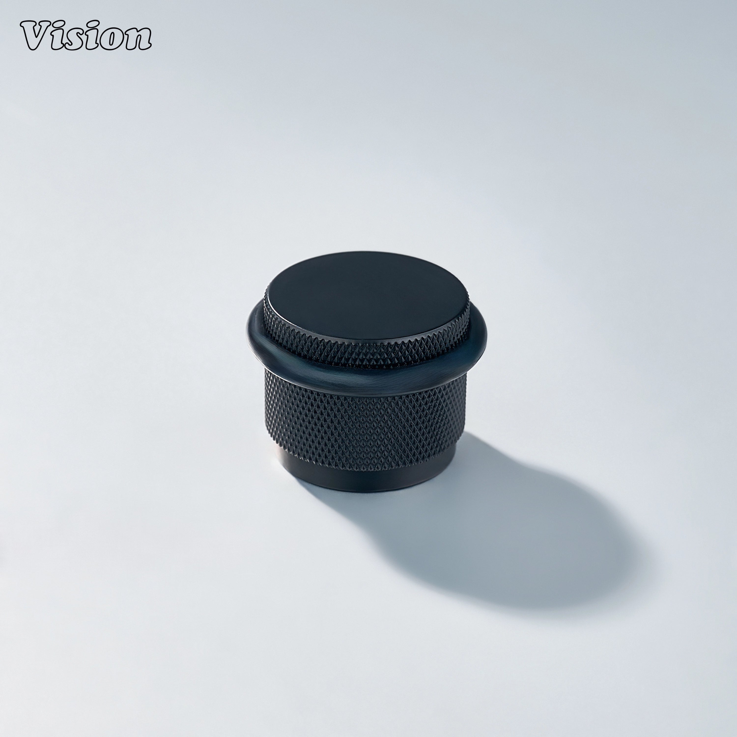 Contemporary Black door stop with textured brass construction and rubber buffer for residential doors