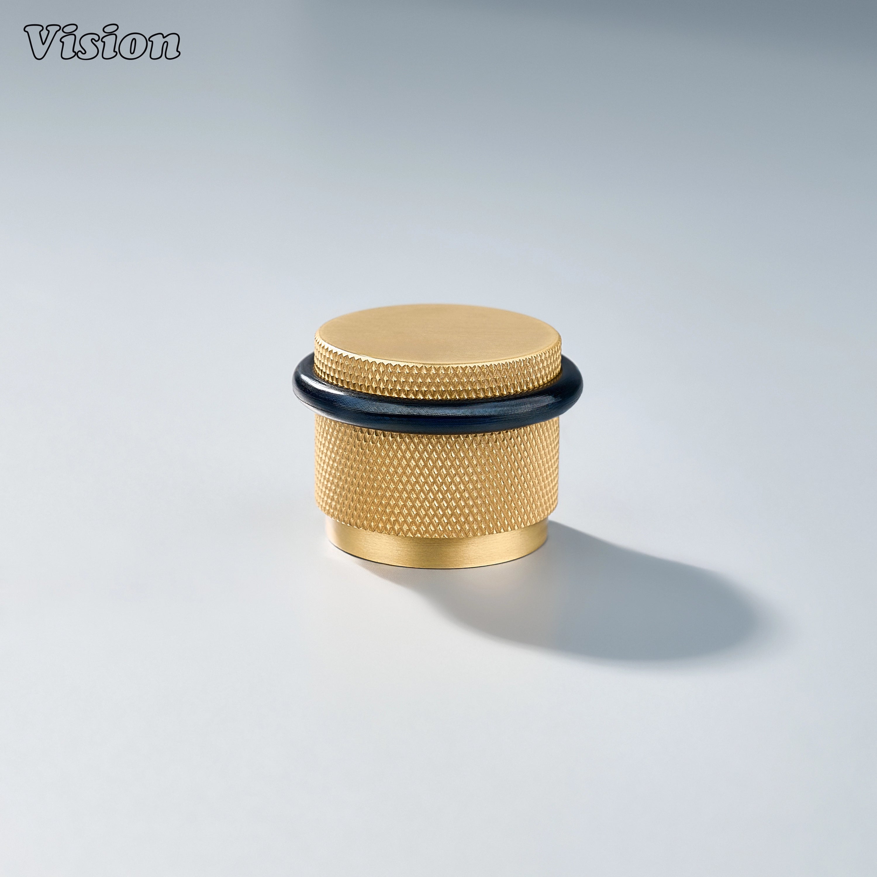 Round Gold floor door stop with diamond knurled grip pattern for luxury cabinet areas and interior spaces