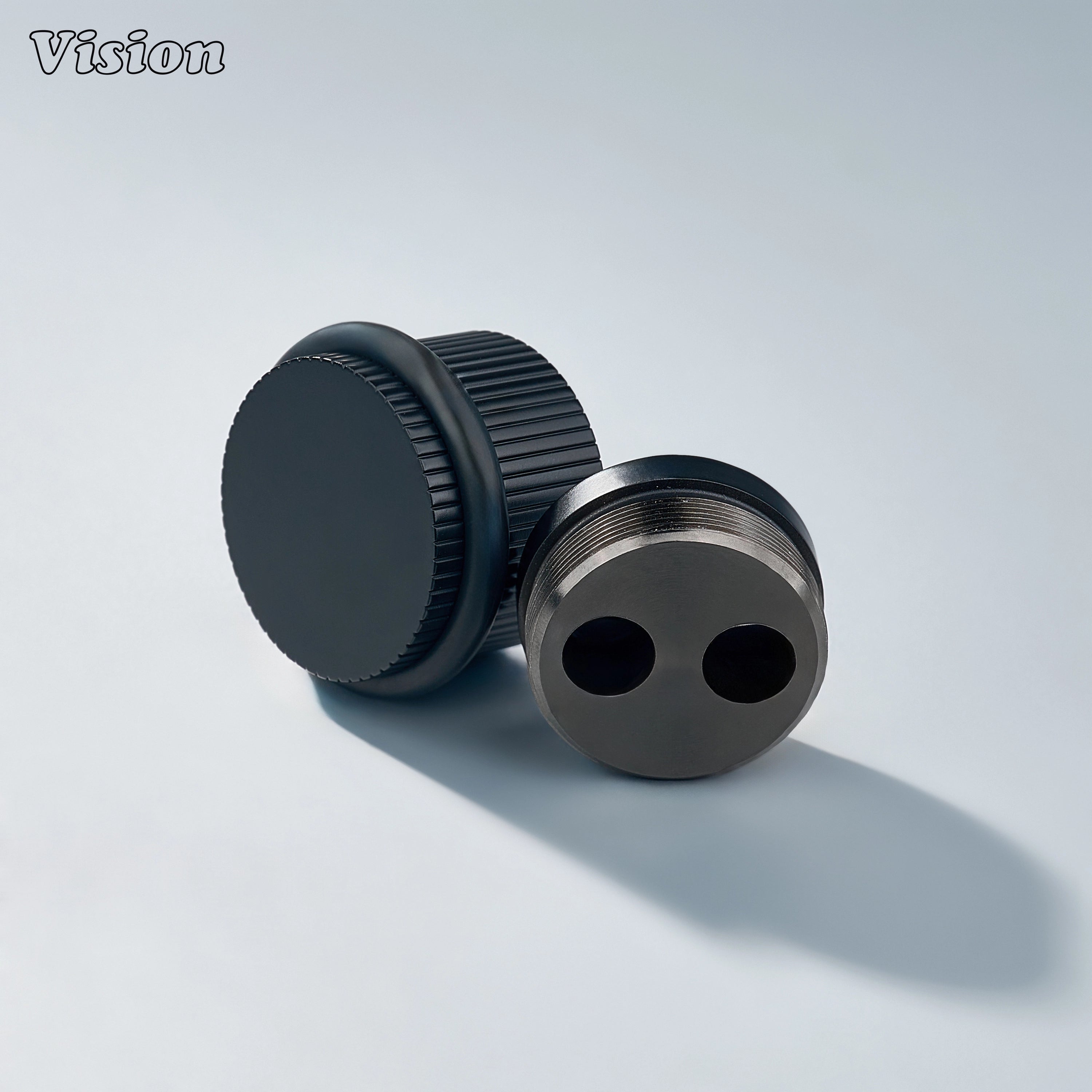 Black linear knurled floor door stop with cylindrical body for luxury furniture and cabinet installations