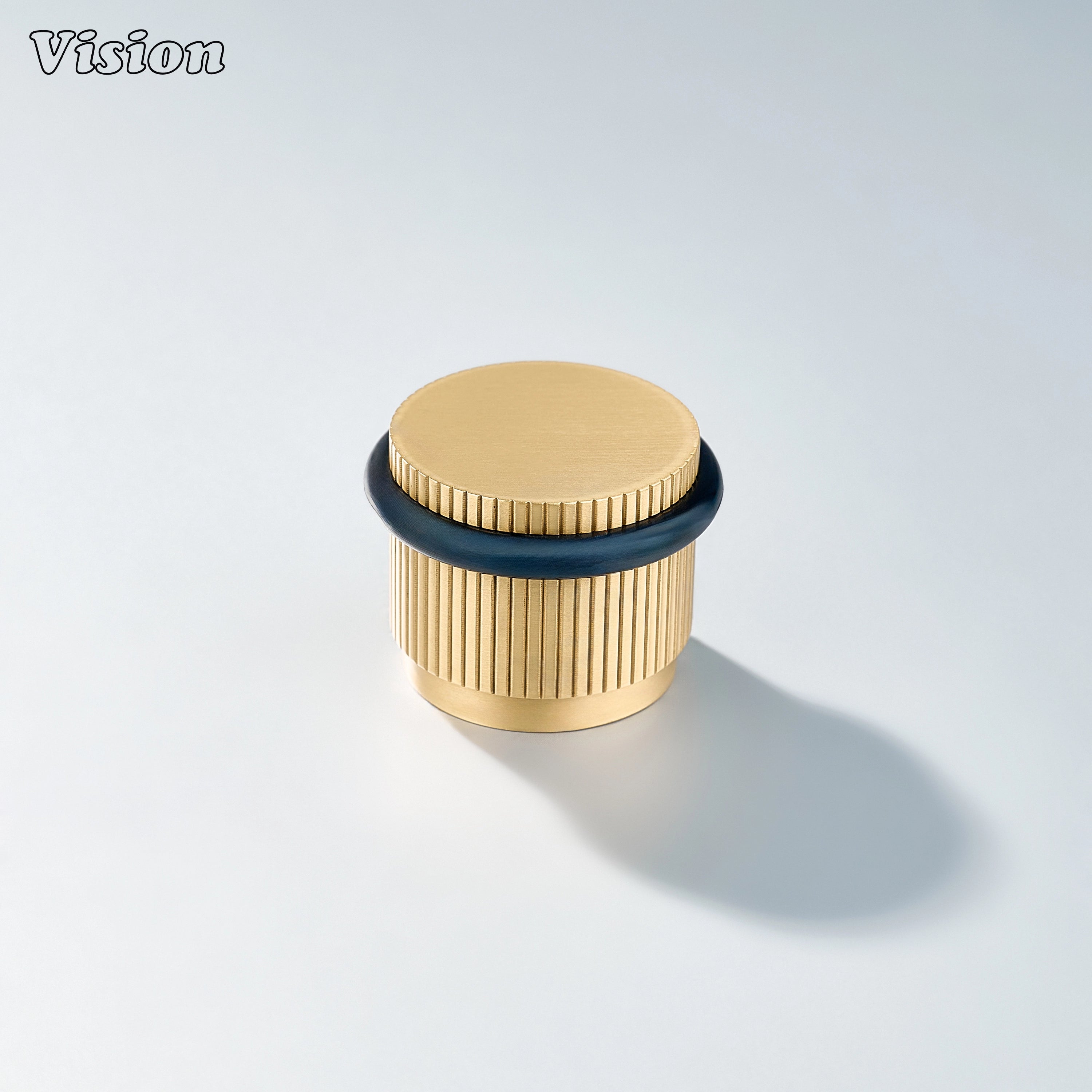 Gold finish linear knurled door stop with round profile for protecting drawers, doors, and wall surfaces