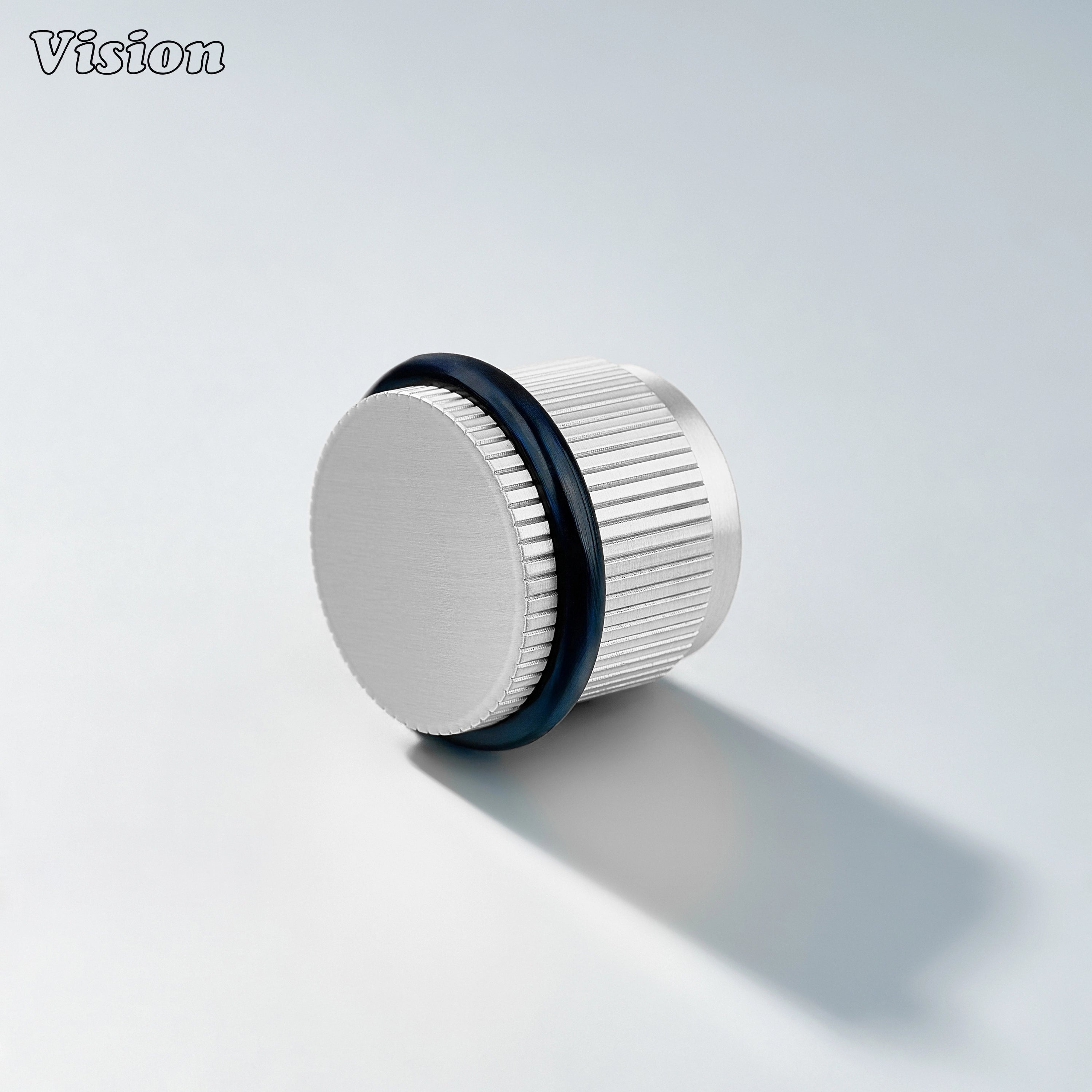 Silver linear knurled door stop with round brass top and rubber bumper for protecting kitchen cabinet doors and walls