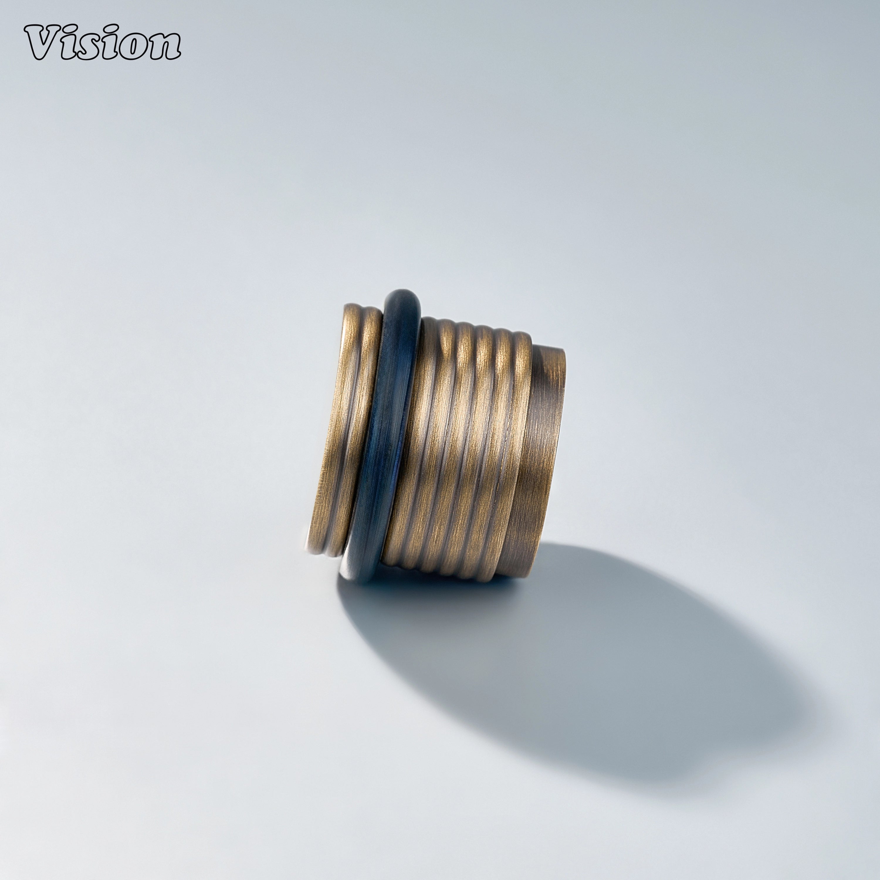 Heavy-duty Antique Bronze brass door stop with ringed cylindrical body for entryways and wardrobes