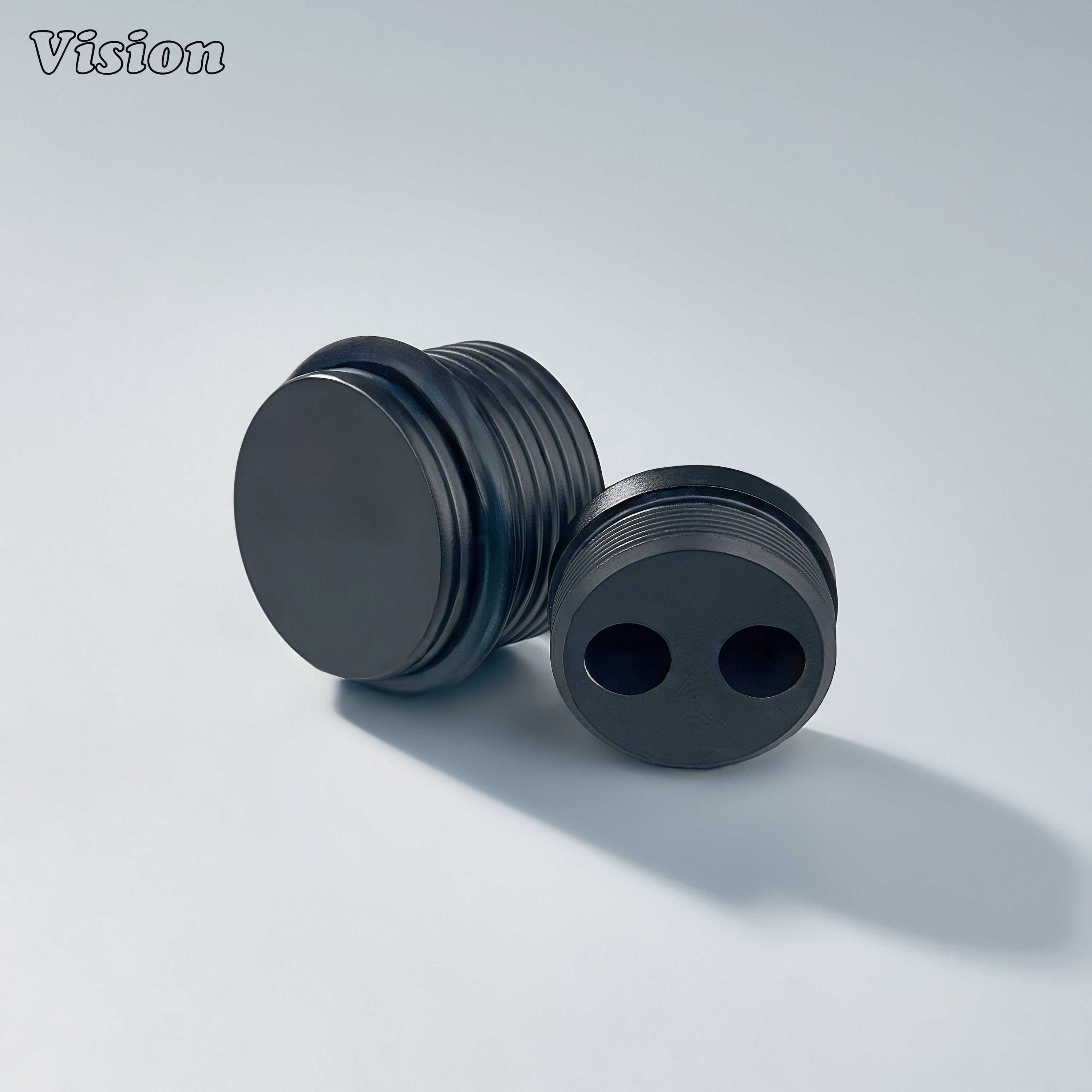 Black solid brass door stop with ringed texture and round profile for luxury furniture installations