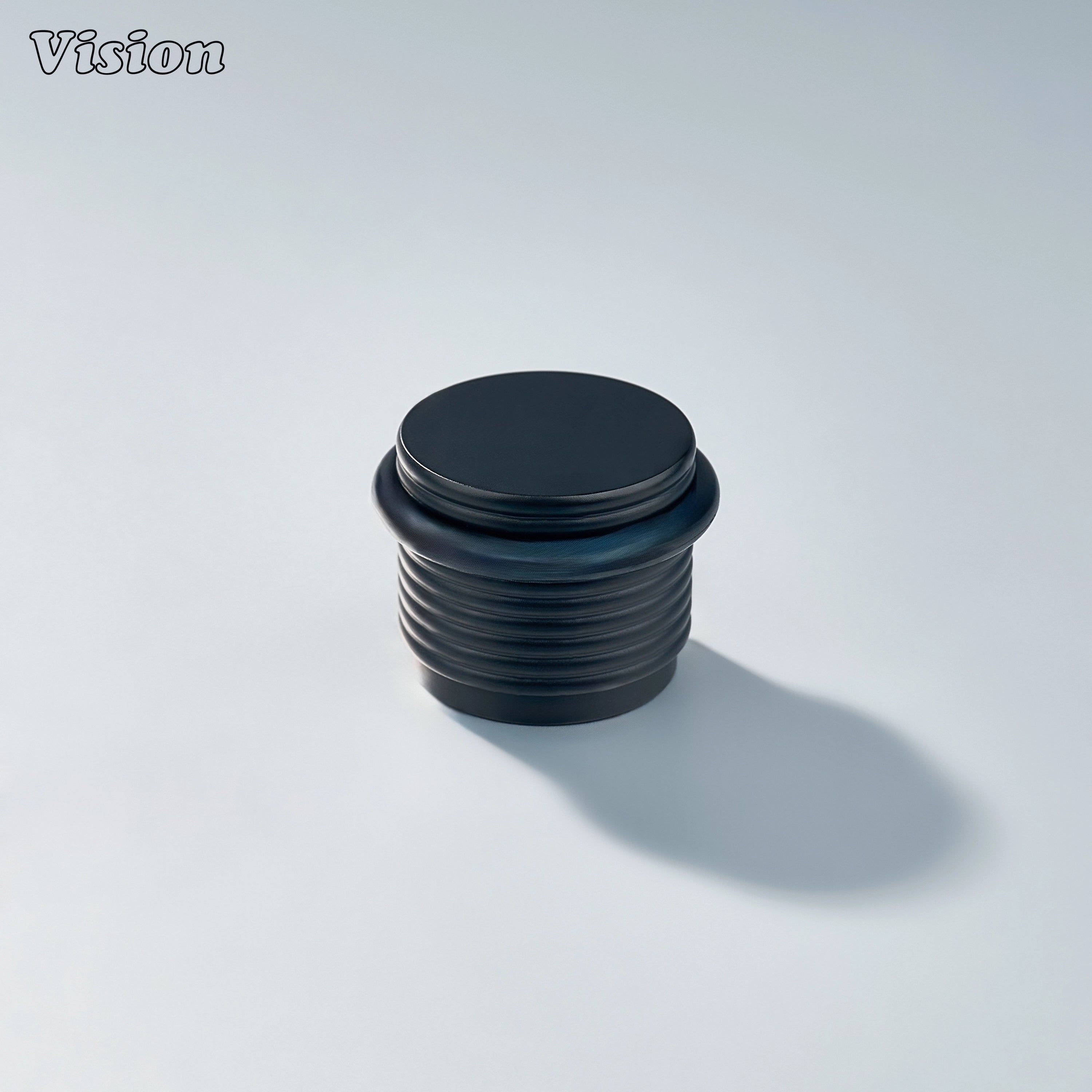 Architectural Black ringed door stop with decorative ridge detailing for protecting doors and wall surfaces