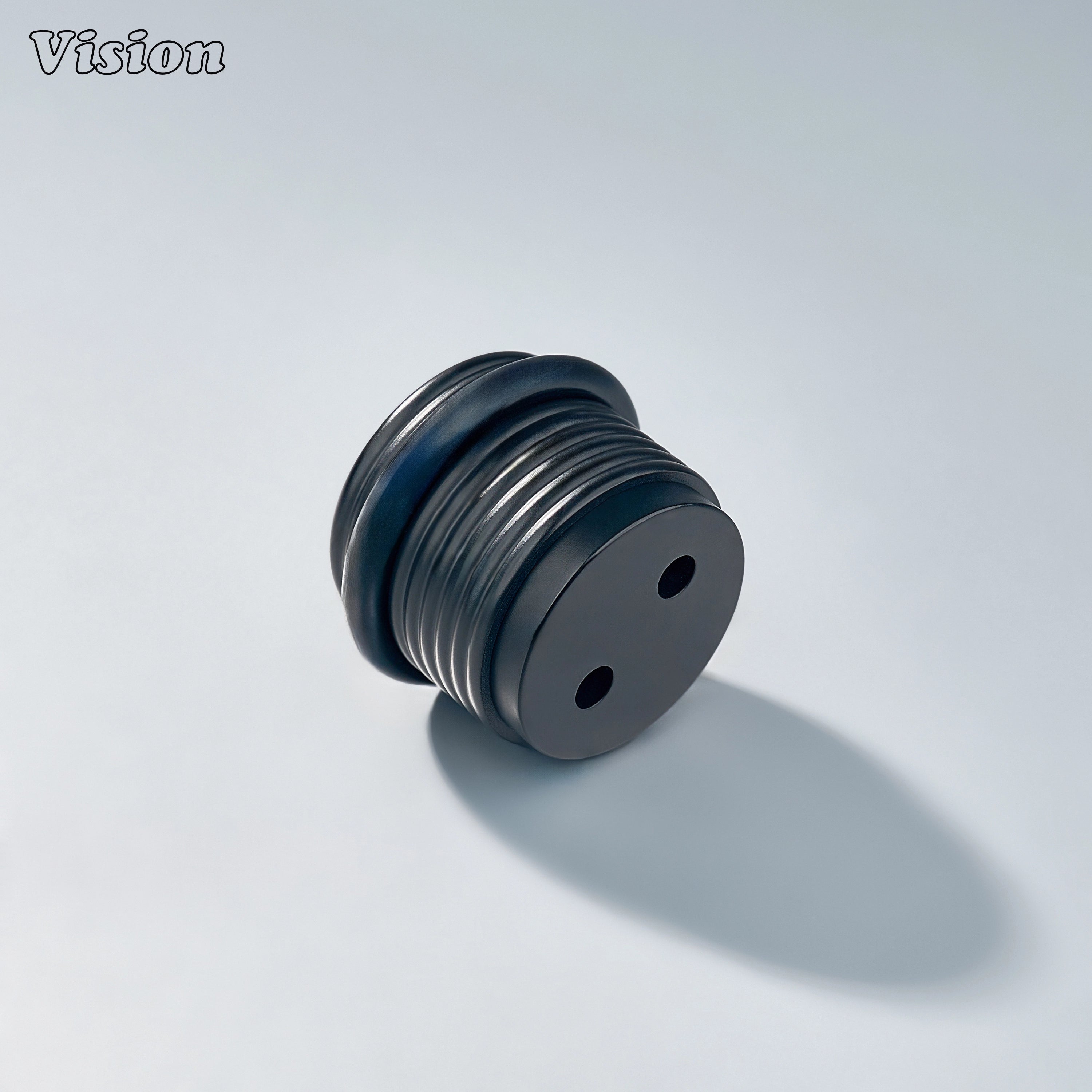 Black floor door stop with concentric ring profile and rubber bumper for residential cabinetry applications