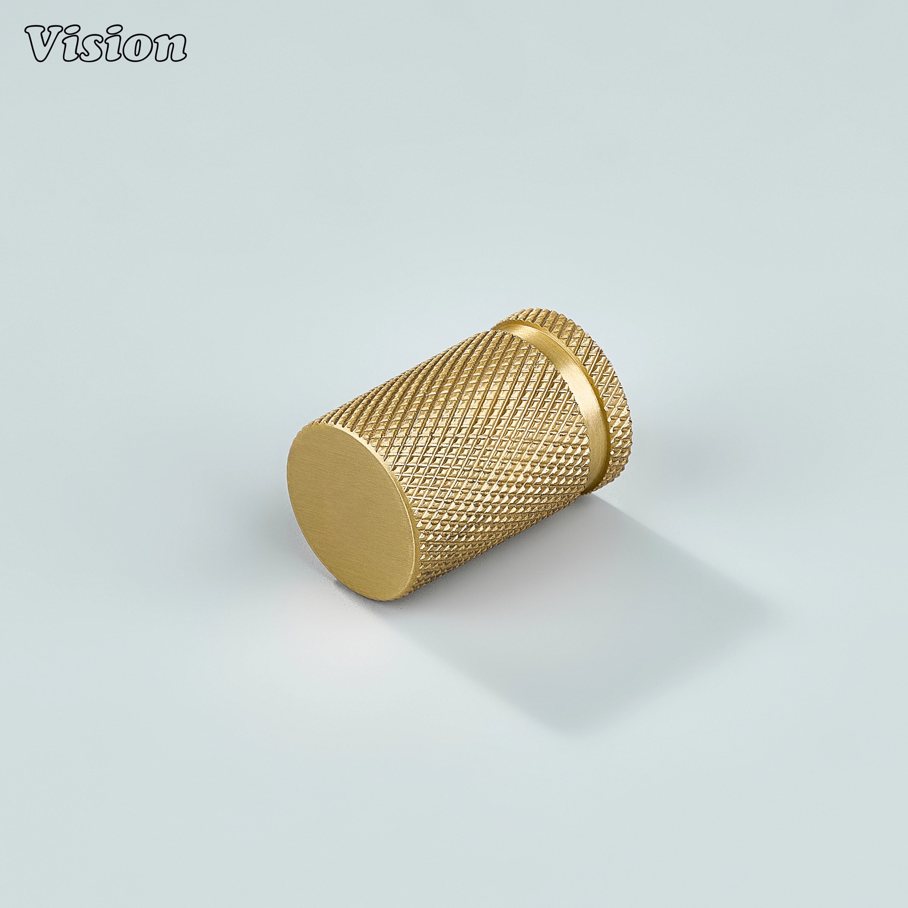 Modern gold brass knurled cylinder knob for kitchen cabinets.