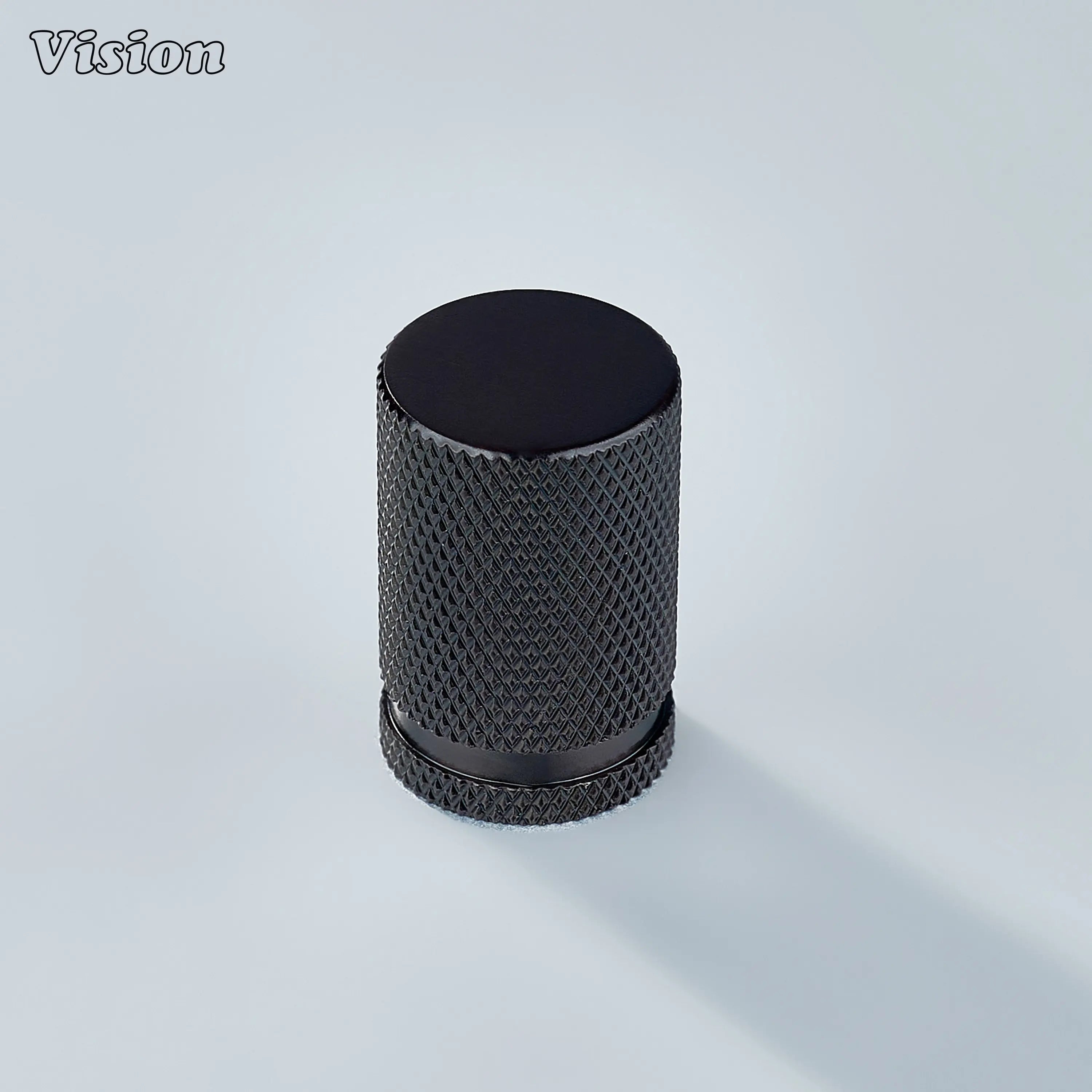 Modern brass knurled cylinder cabinet knob in bronze finish used for kitchen drawers.