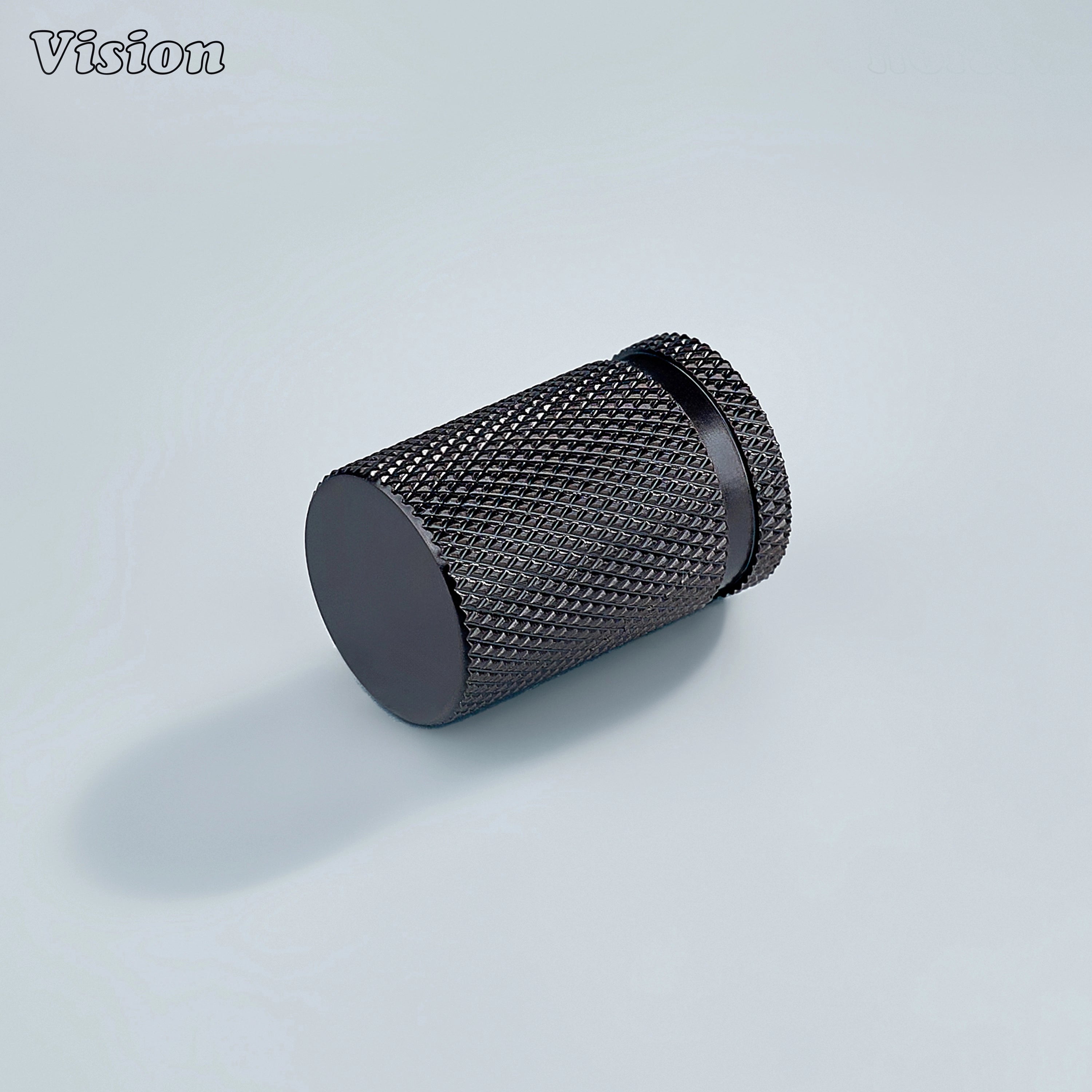 Modern brass knurled cylinder cabinet knob in bronze finish used for furniture drawers.