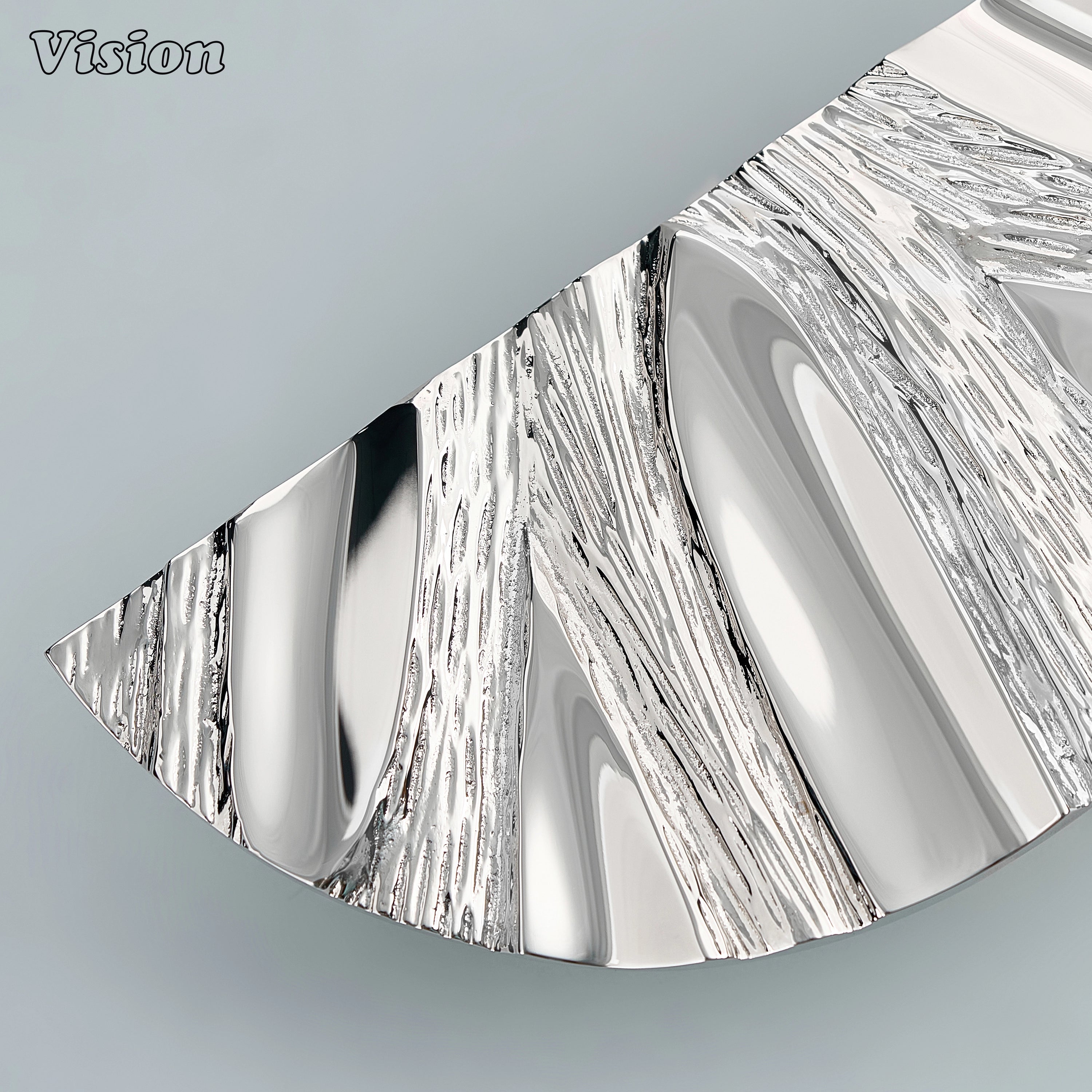 Elegant Polished Nickel semi circle door handle with textured sculptural profile.
