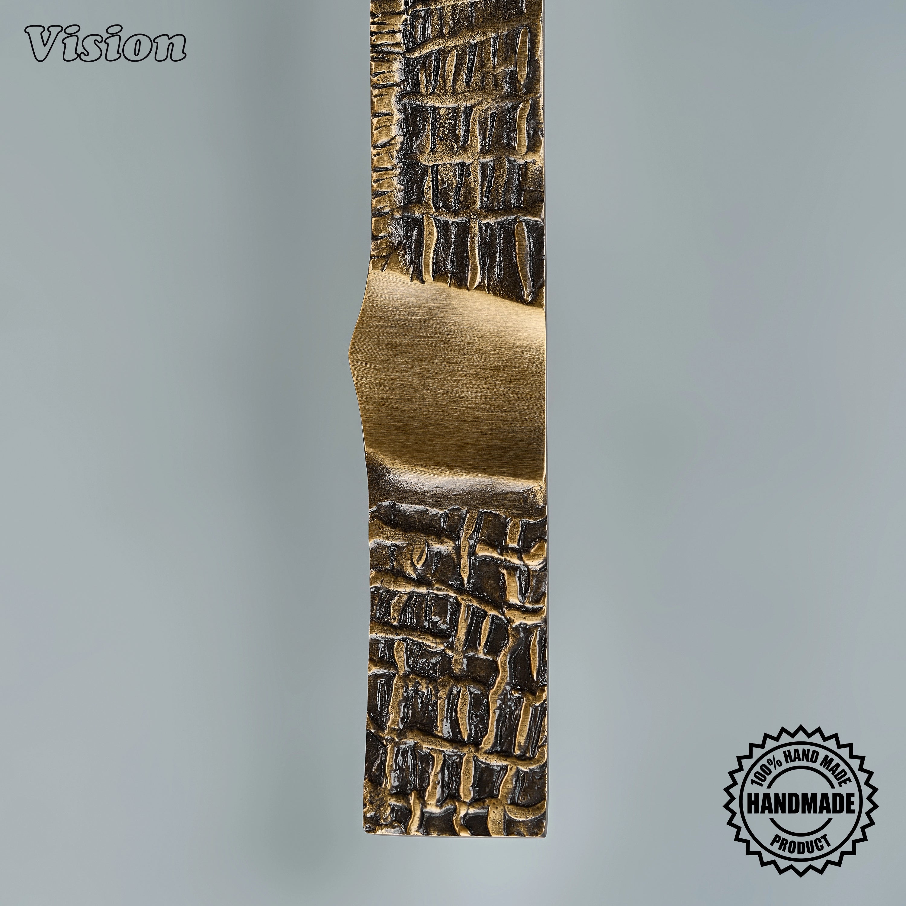 Handcrafted antique bronze appliance pull with organic grid relief on oversized architectural entry doors
