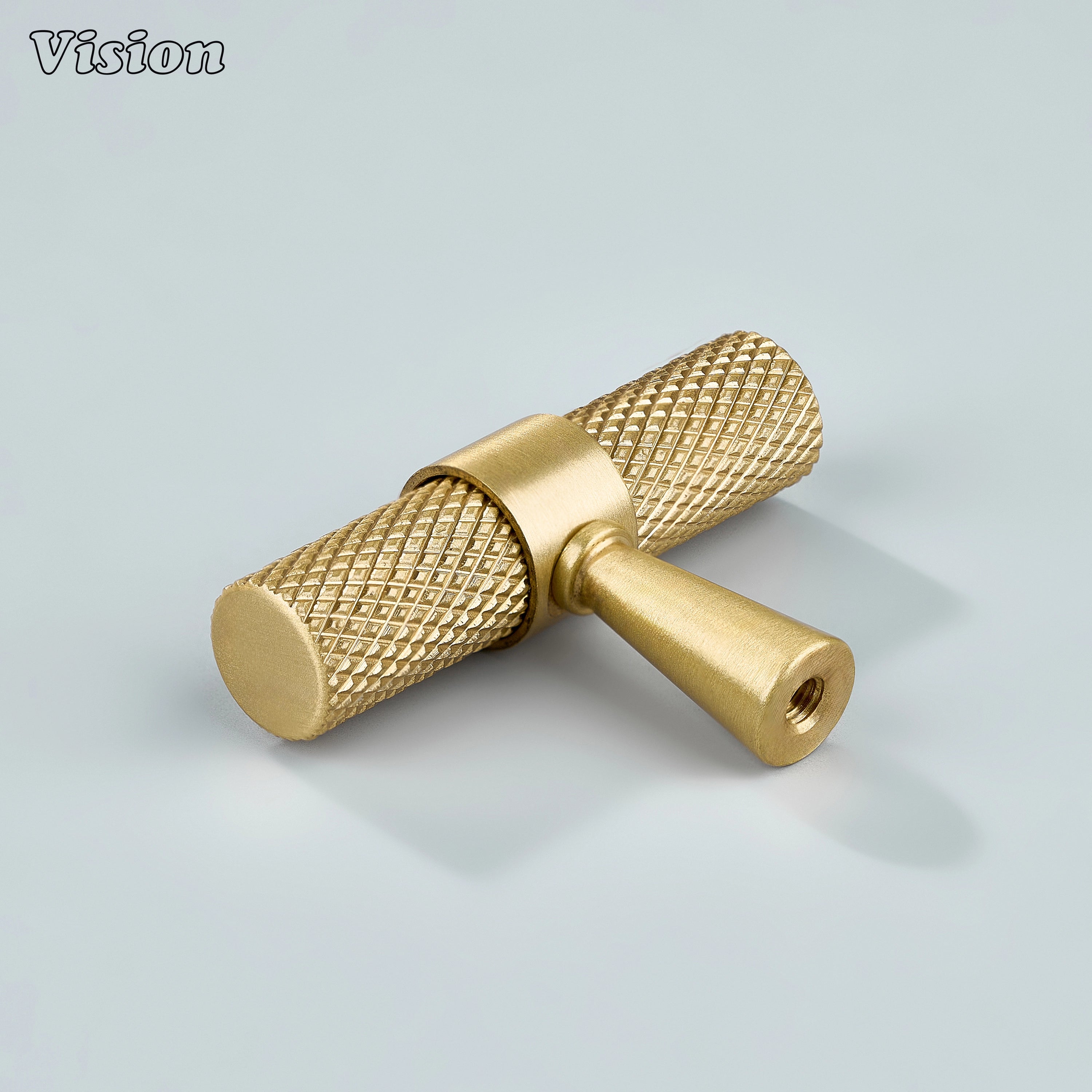 Elegant gold knurled T-knob used for cupboards and furniture.