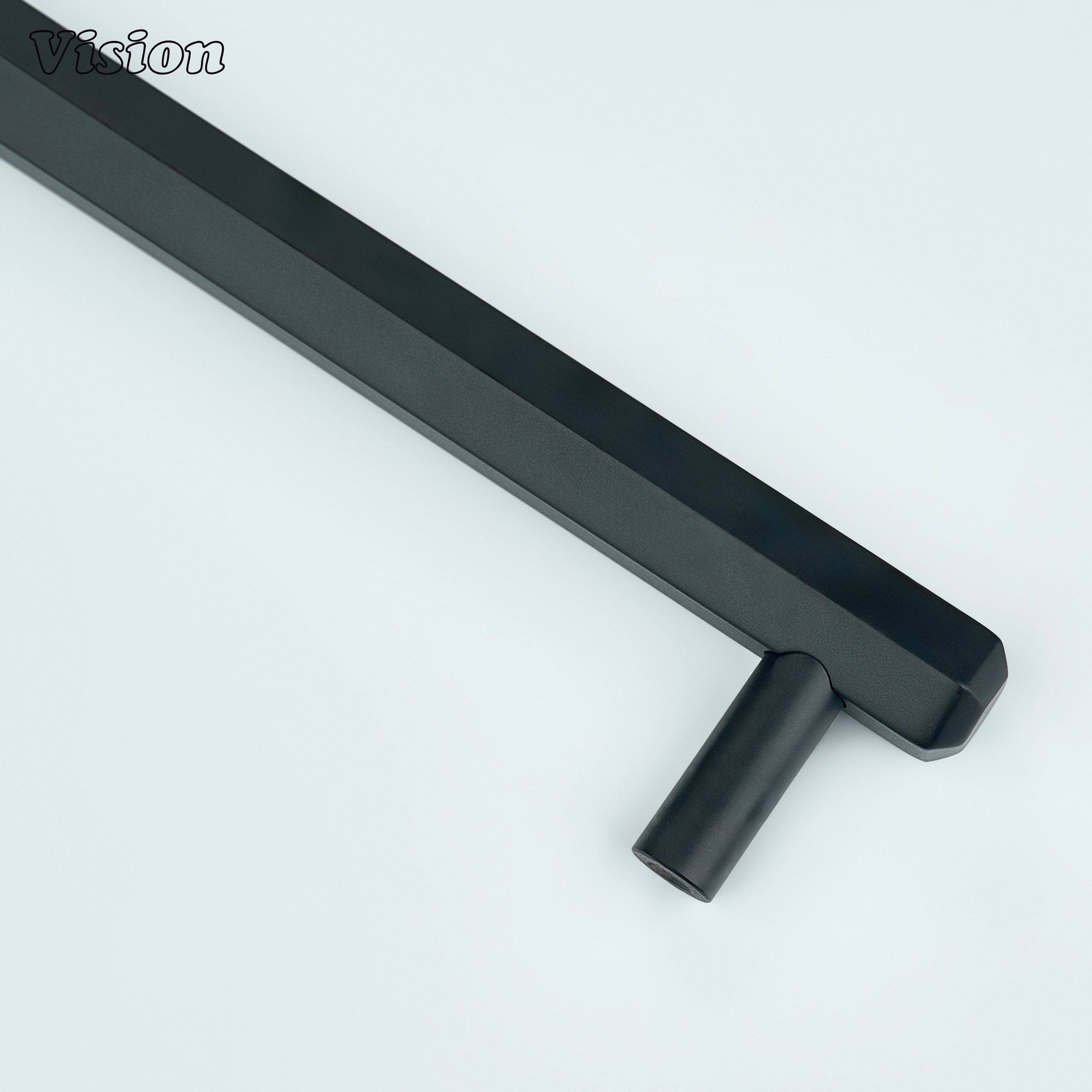 Black cabinet handle showcasing hexagon bar profile and round legs for furniture