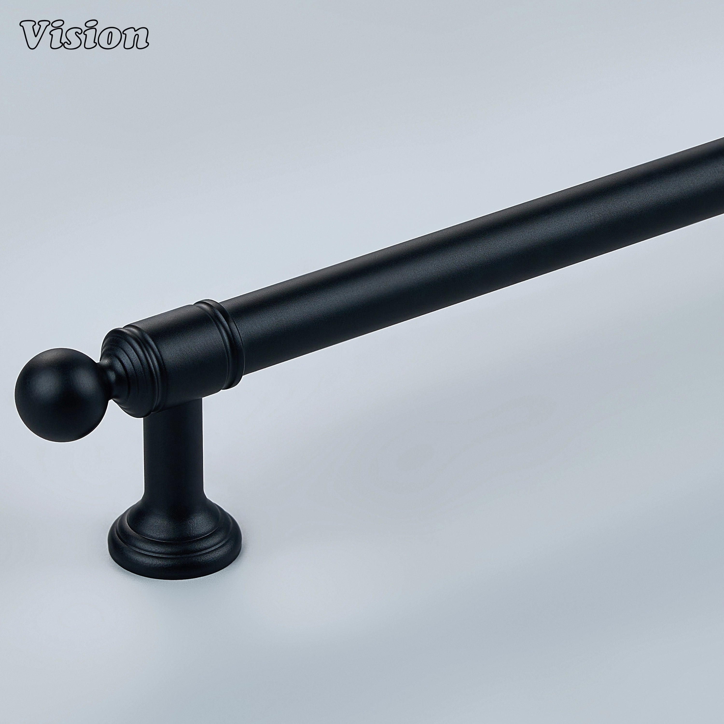 Black solid brass cabinet pull with stepped geometric profile on modern kitchen cabinets