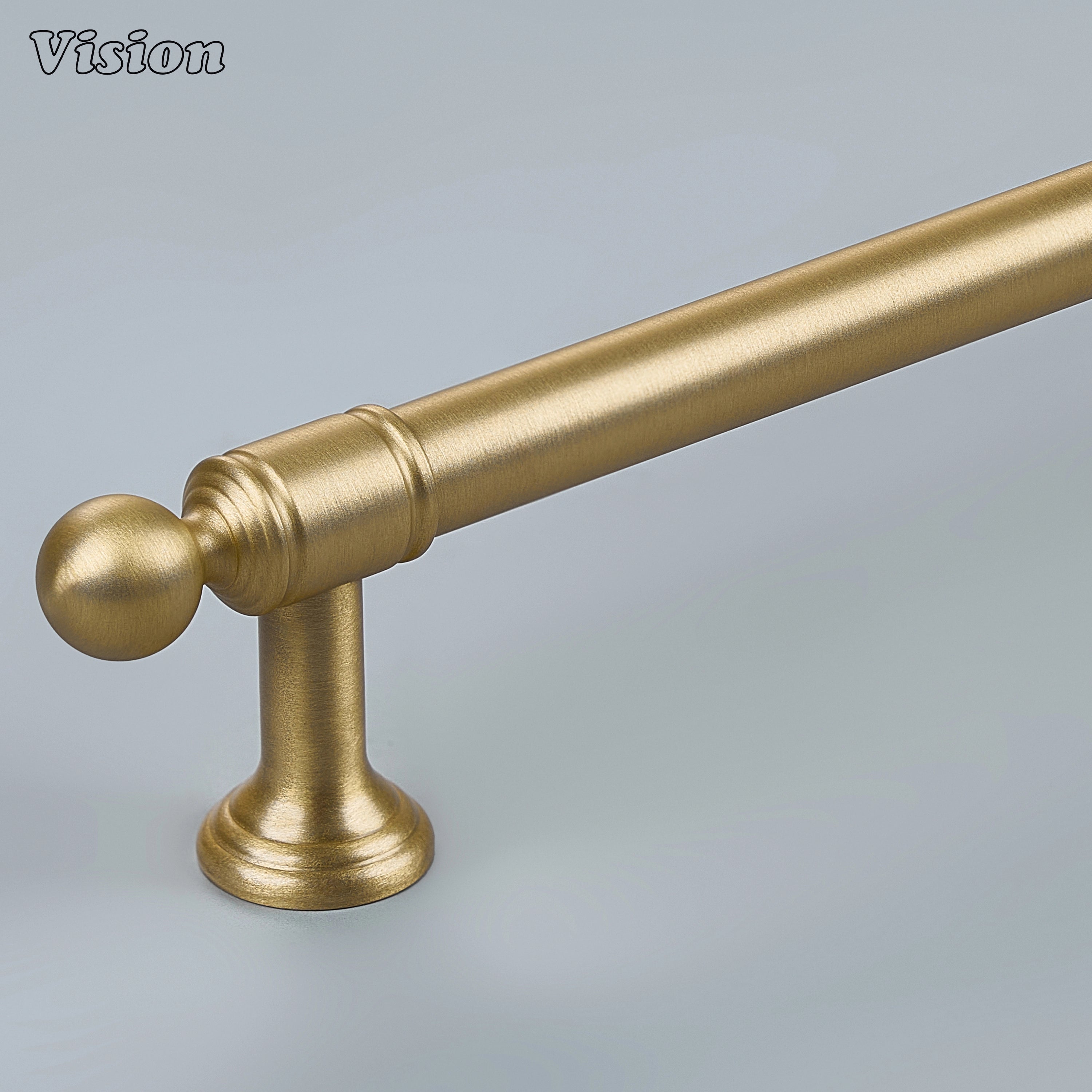 Gold solid brass cabinet pull with stepped geometric profile on modern kitchen cabinets