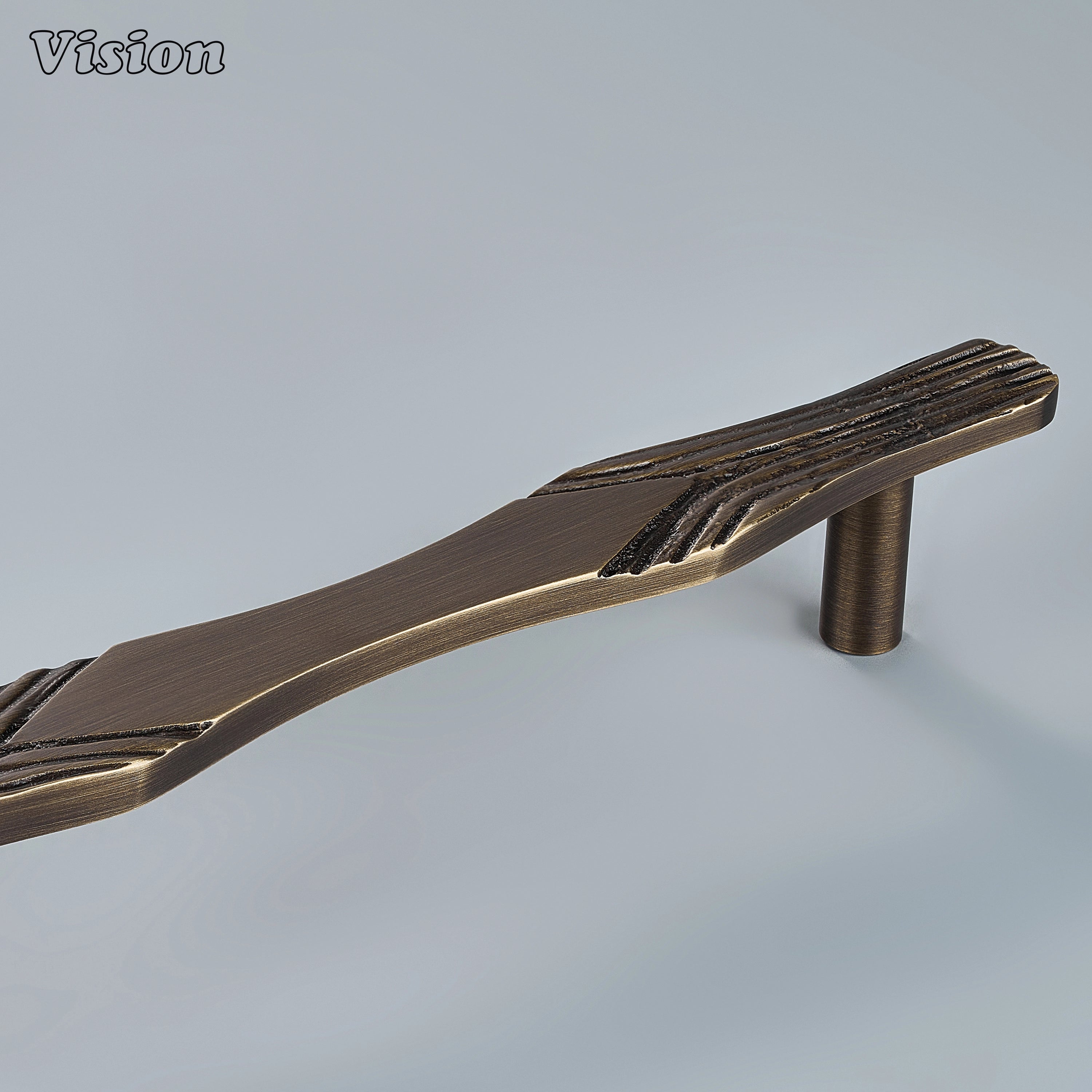 Handcrafted antique bronze cabinet handle with textured ends and smooth center on vanity drawers