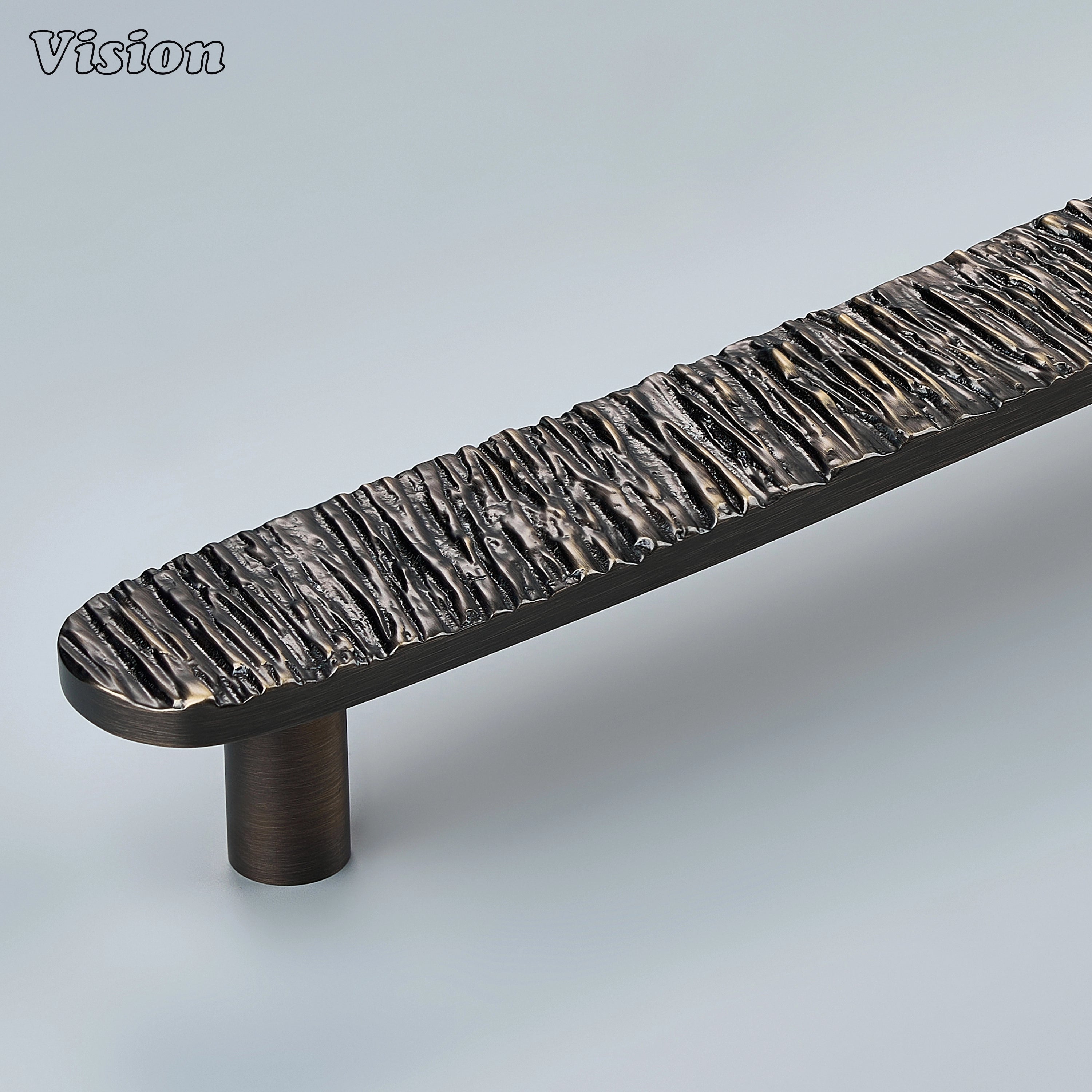 Premium Antique Bronze half round handcrafted door handle featuring an organic textured profile for designer furniture.