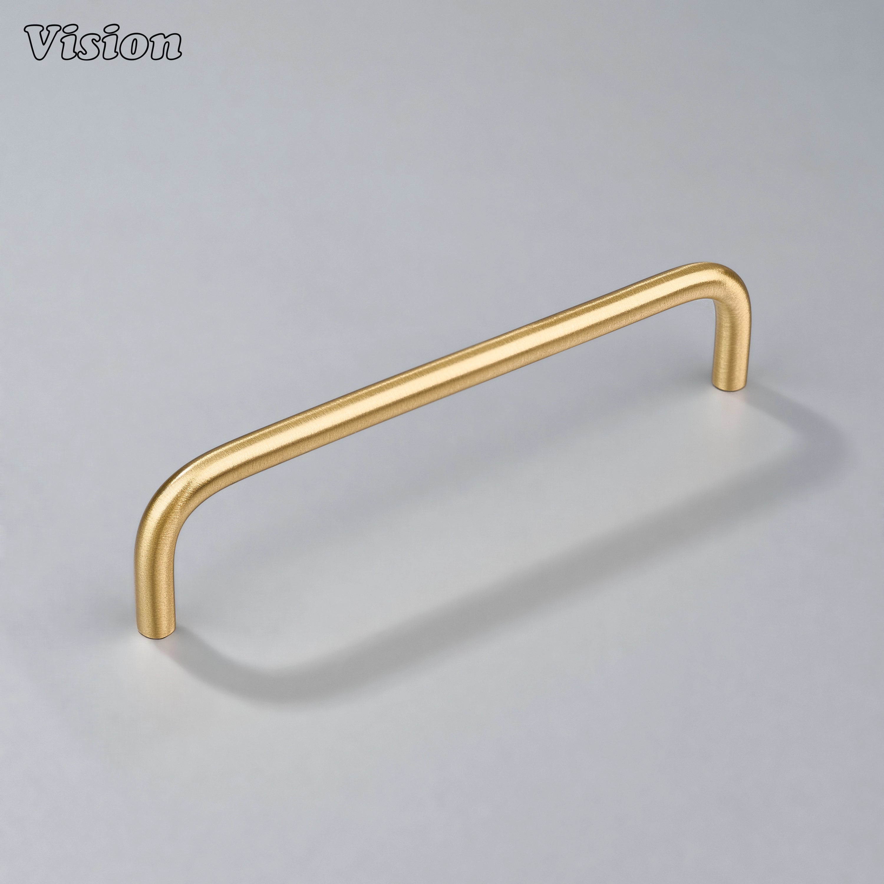 Gold cabinet pull with rounded tubular bar for custom kitchen cabinetry.