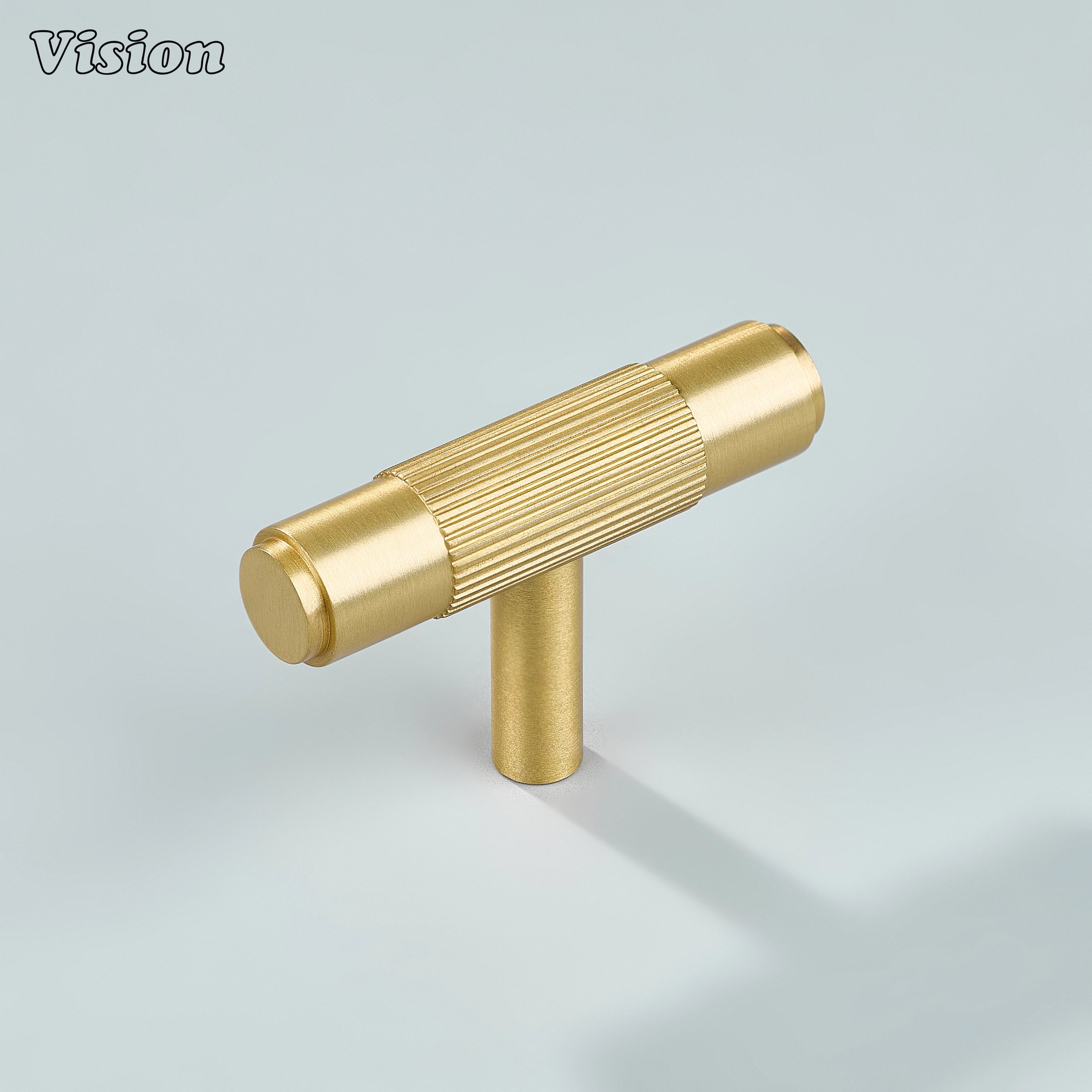 Gold brass linear knurled T-knob for modern kitchen cabinets.